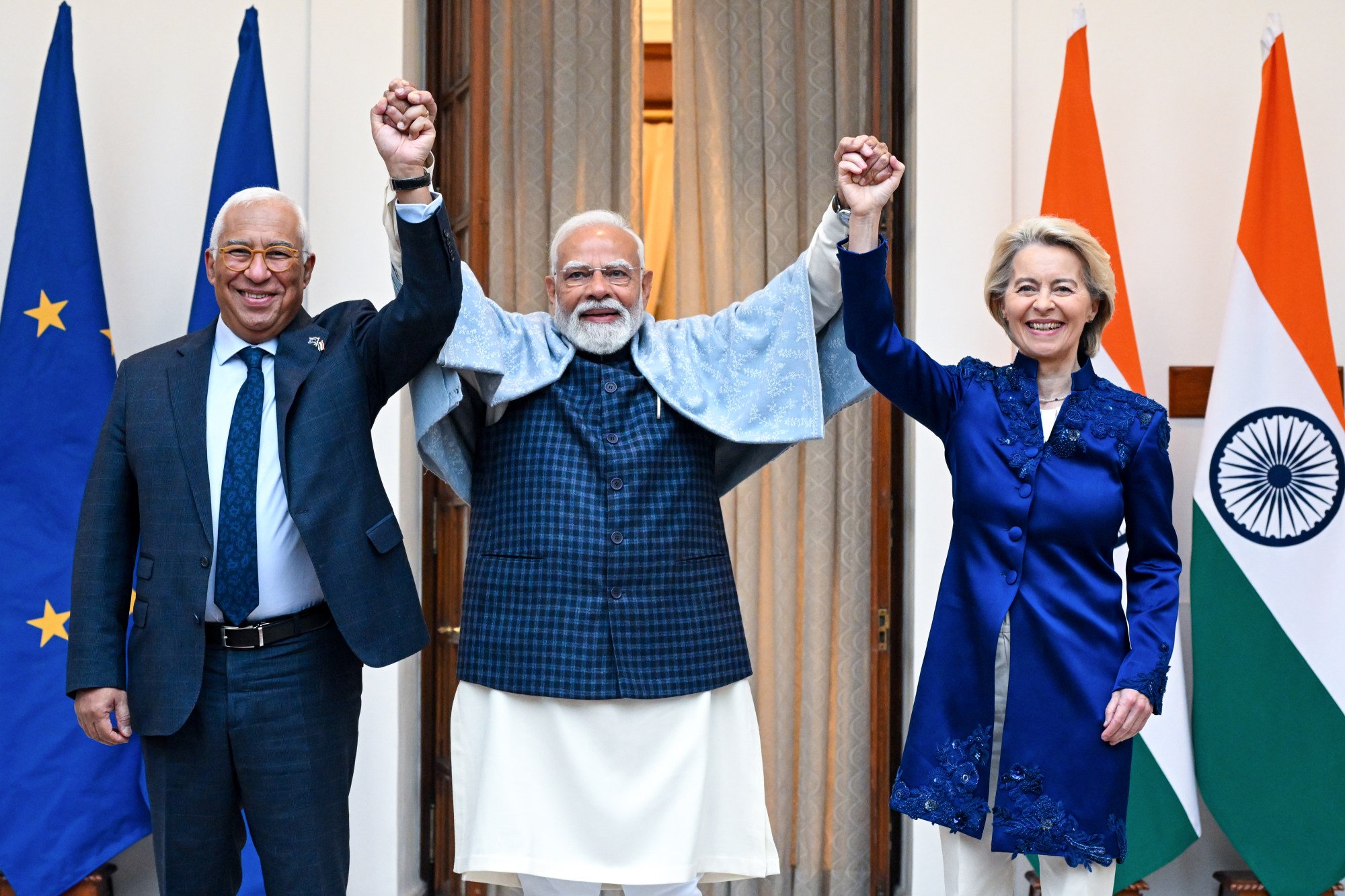 Left to right: Antonio Costa, president of the European Council; Narendra Modi, India’s prime minister; and Ursula von der Leyen, president of the European Commission, raise their joined hands as they pose for photographs at Hyderabad House in New Delhi, India, on Tuesday. Photo: European Council/dpa