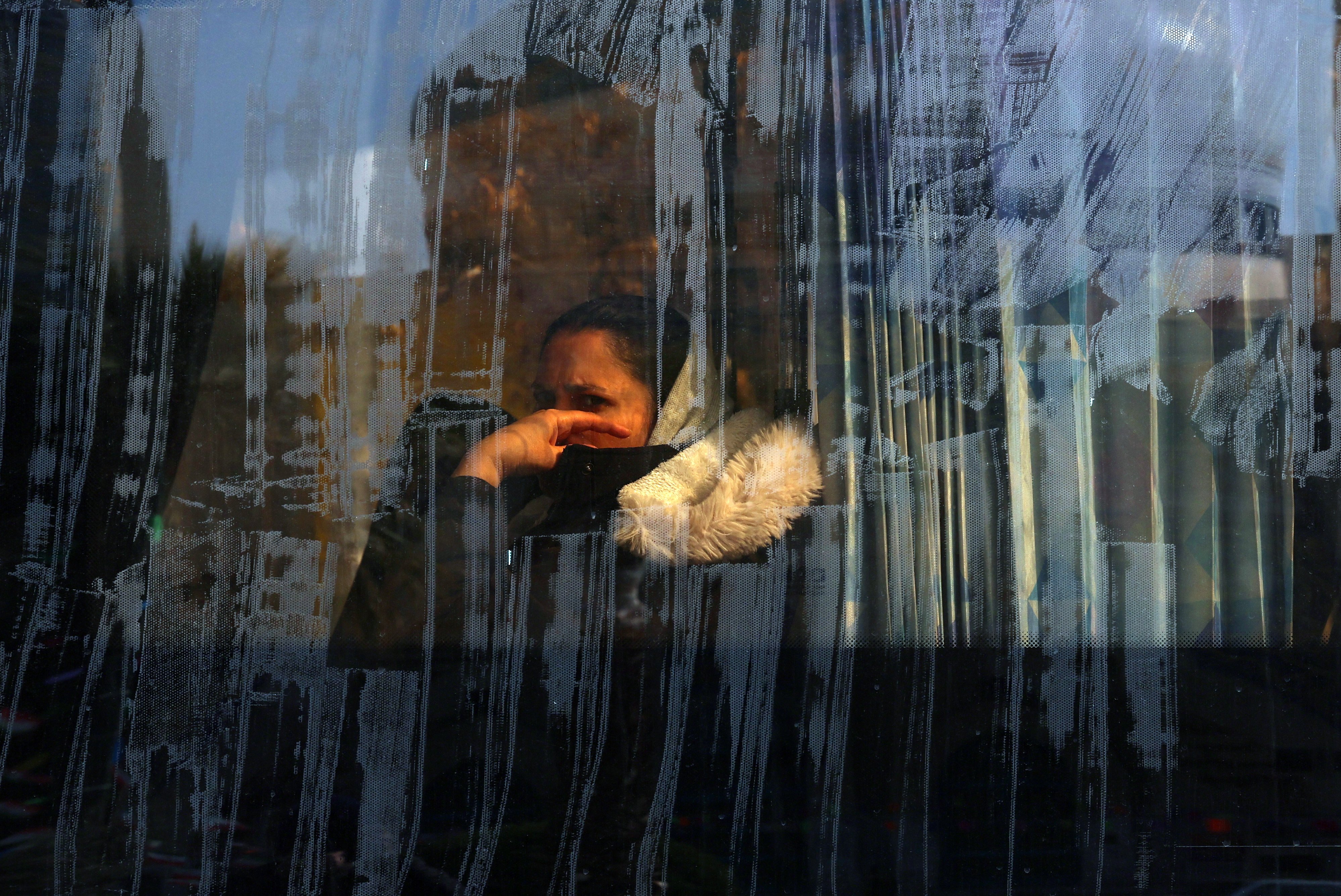 An woman sits on a bus in Tehran, Iran, on Thursday. Photo: EPA
