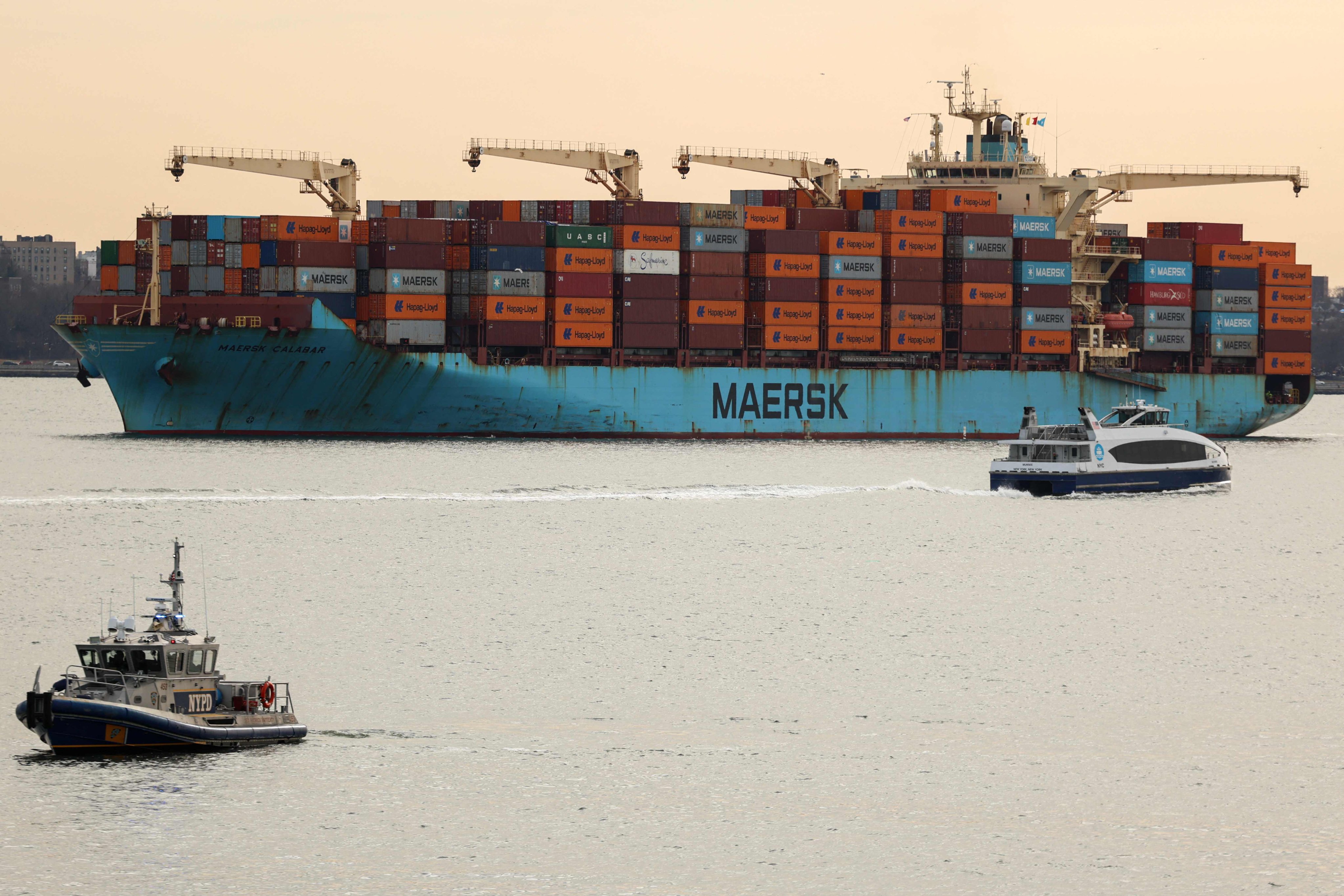 A cargo ship loaded with shipping containers navigates through New York Bay on January 23. Photo: AFP