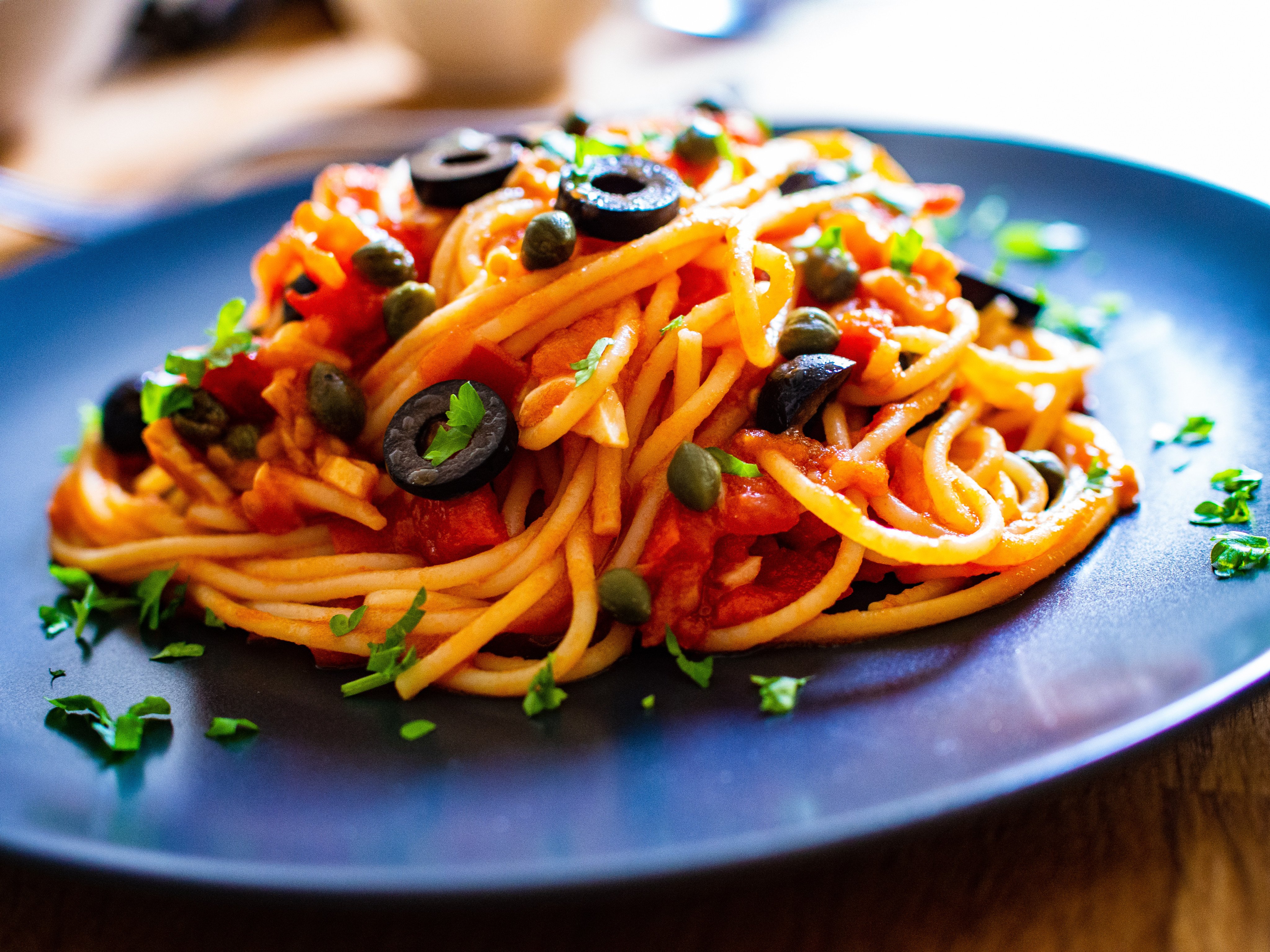 Pasta puttanesca with tomato sauce, anchovies, chilli, olives and capers. Photo: Shutterstock
