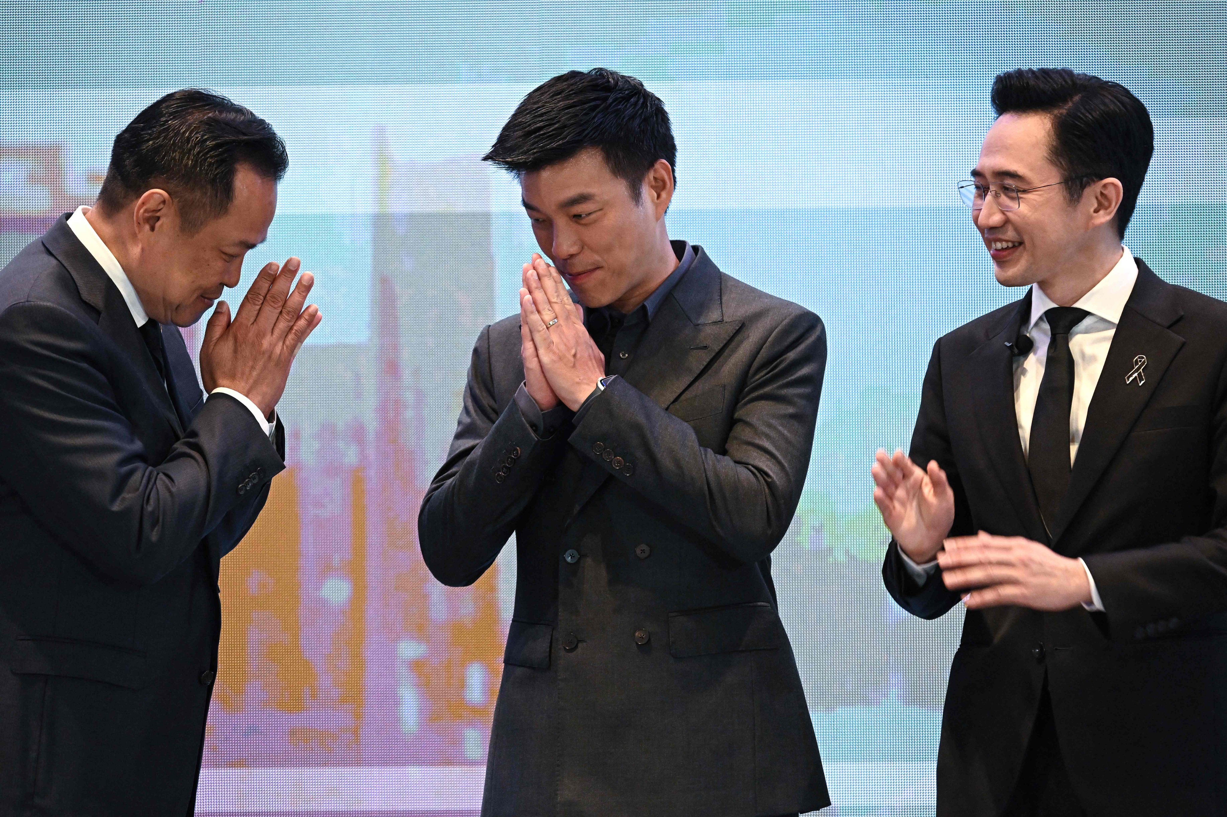 From left: Anutin Charnvirakul, Natthaphong Ruengpanyawut and Yodchanan Wongsawat during an event in Bangkok on January 12. The three are among prime ministerial candidates in Thailand’s coming election. Photo: AFP