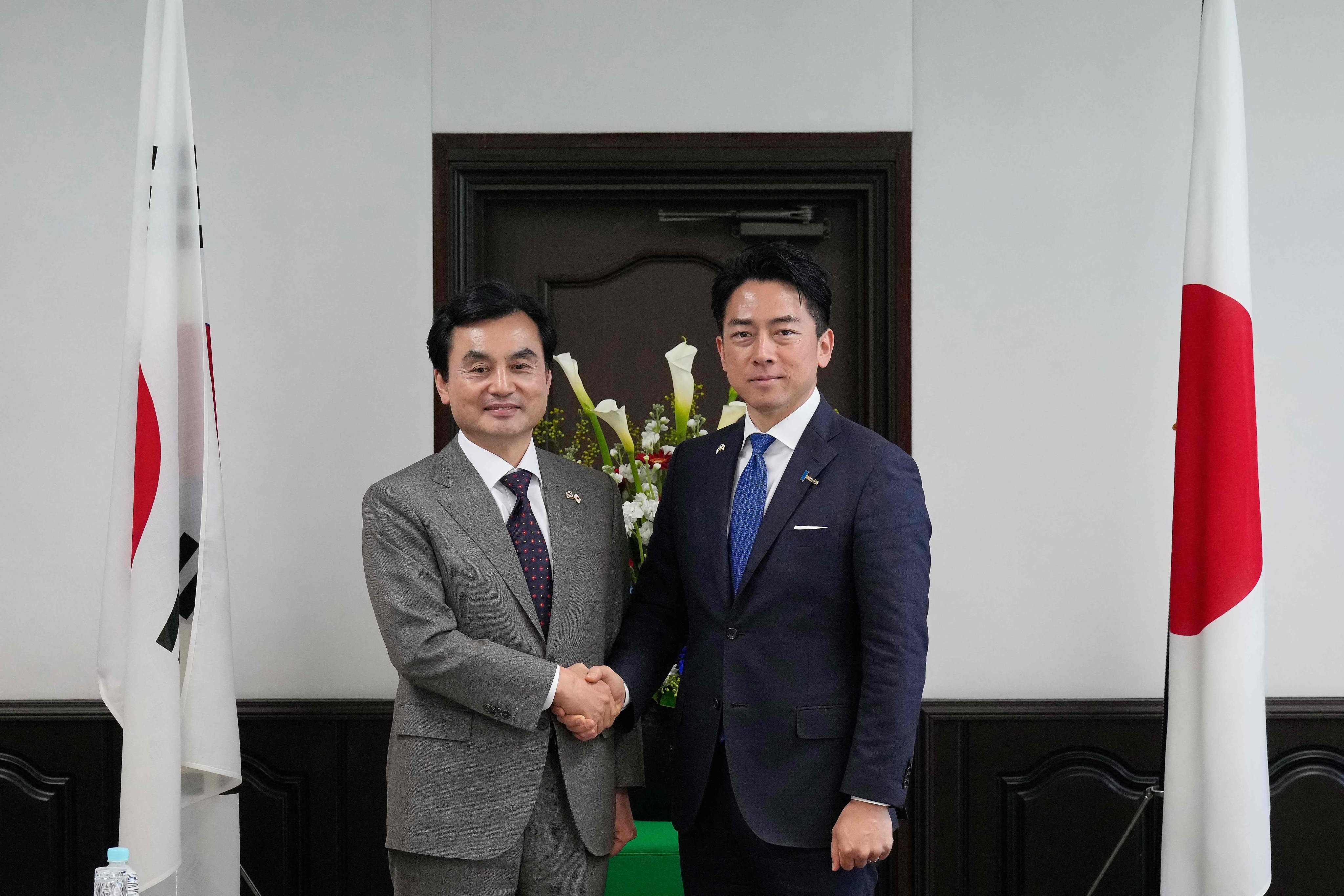 Japan’s Defence Minister Shinjiro Koizumi (right) and South Korea’s Defence Minister Ahn Gyu-back  shake hands before their meeting at Japan’s Yokosuka naval base near Tokyo on Friday. Photo: AFP