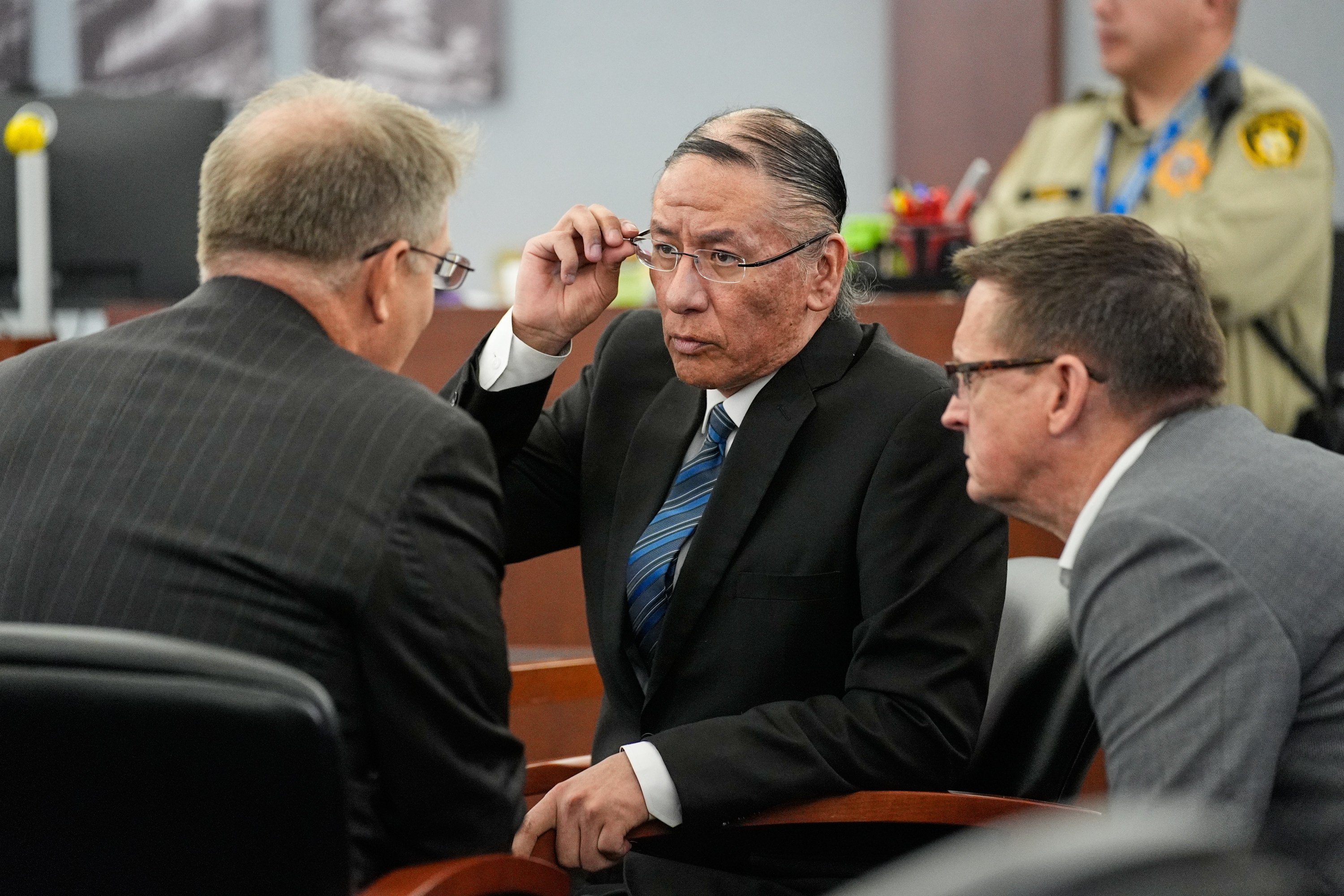 Nathan Chasing Horse (centre) speaks to his lawyers in court on January 20. Photo: AP