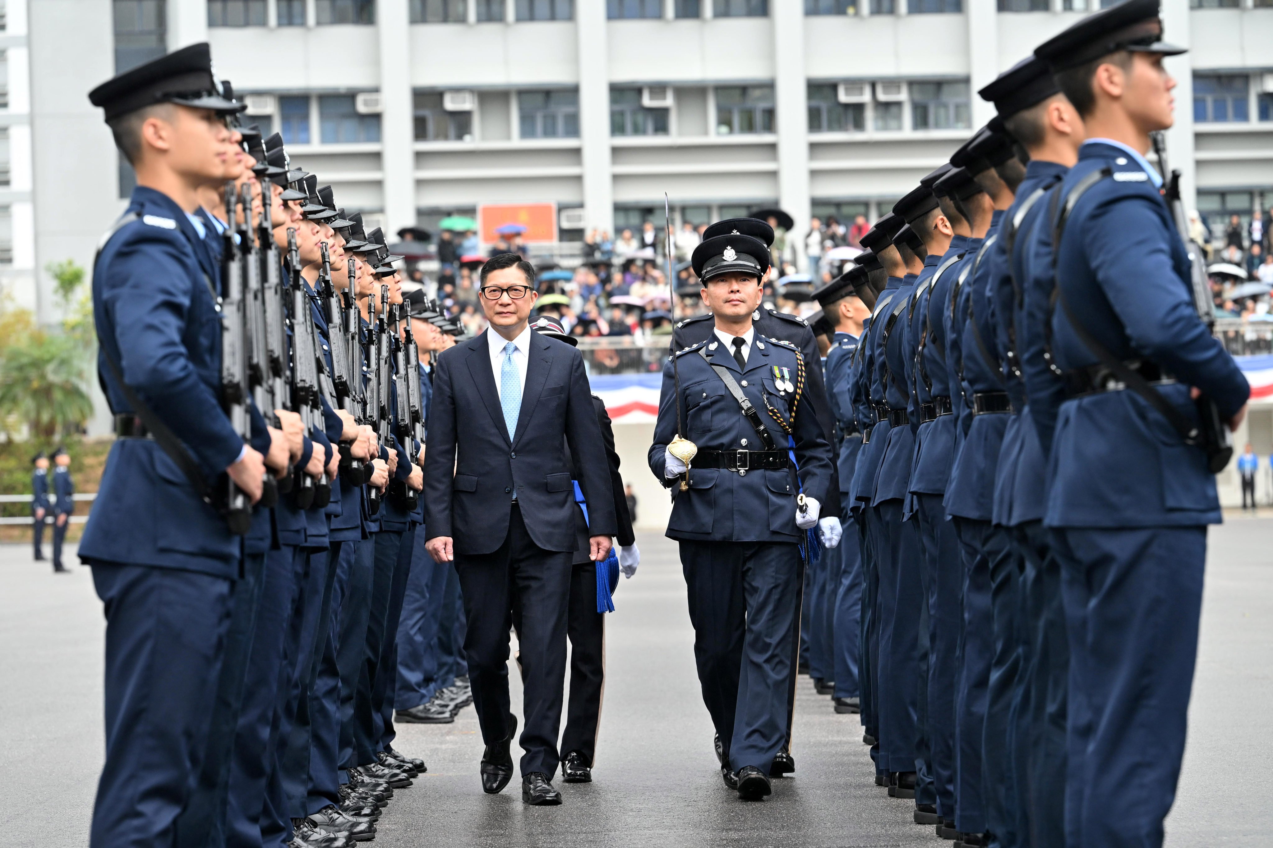 Secretary for Security Chris Tang inspects officers at Saturday’s passing-out parade. Photo: Handout