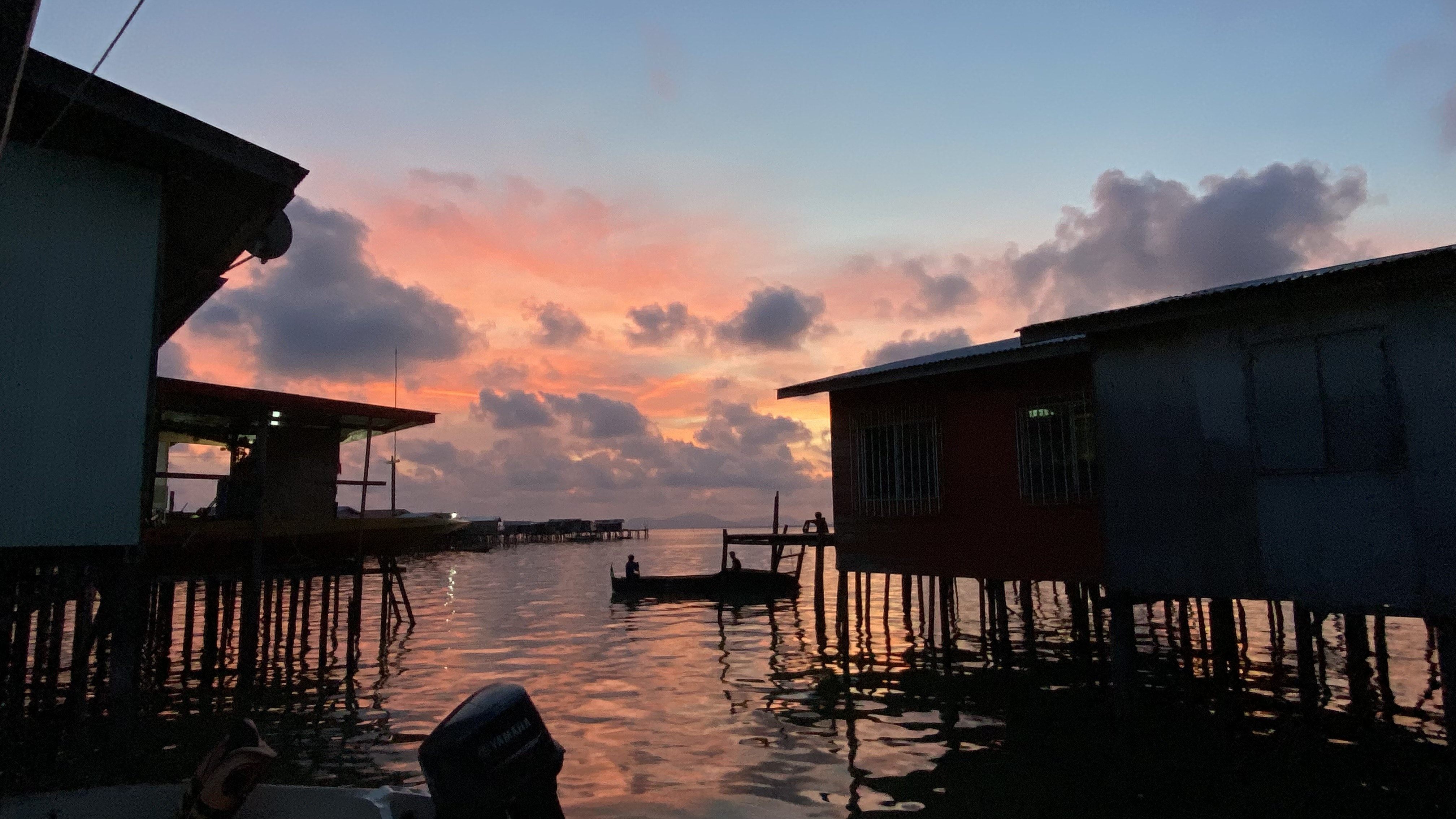 A fisherman goes out in his boat in Semporna, Sabah, Malaysia. Photo:  Ushar Daniele