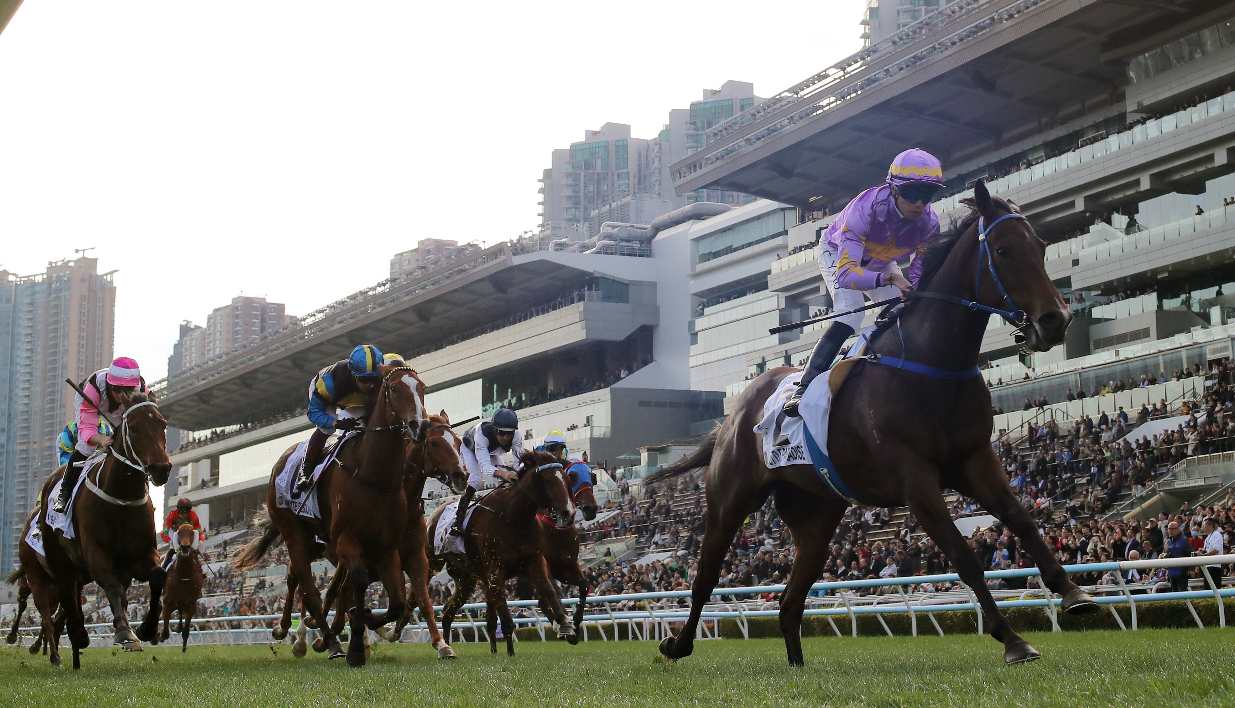 Little Paradise storms clear to win the Classic Mile under Vincent Ho. Photos: Kenneth Chan