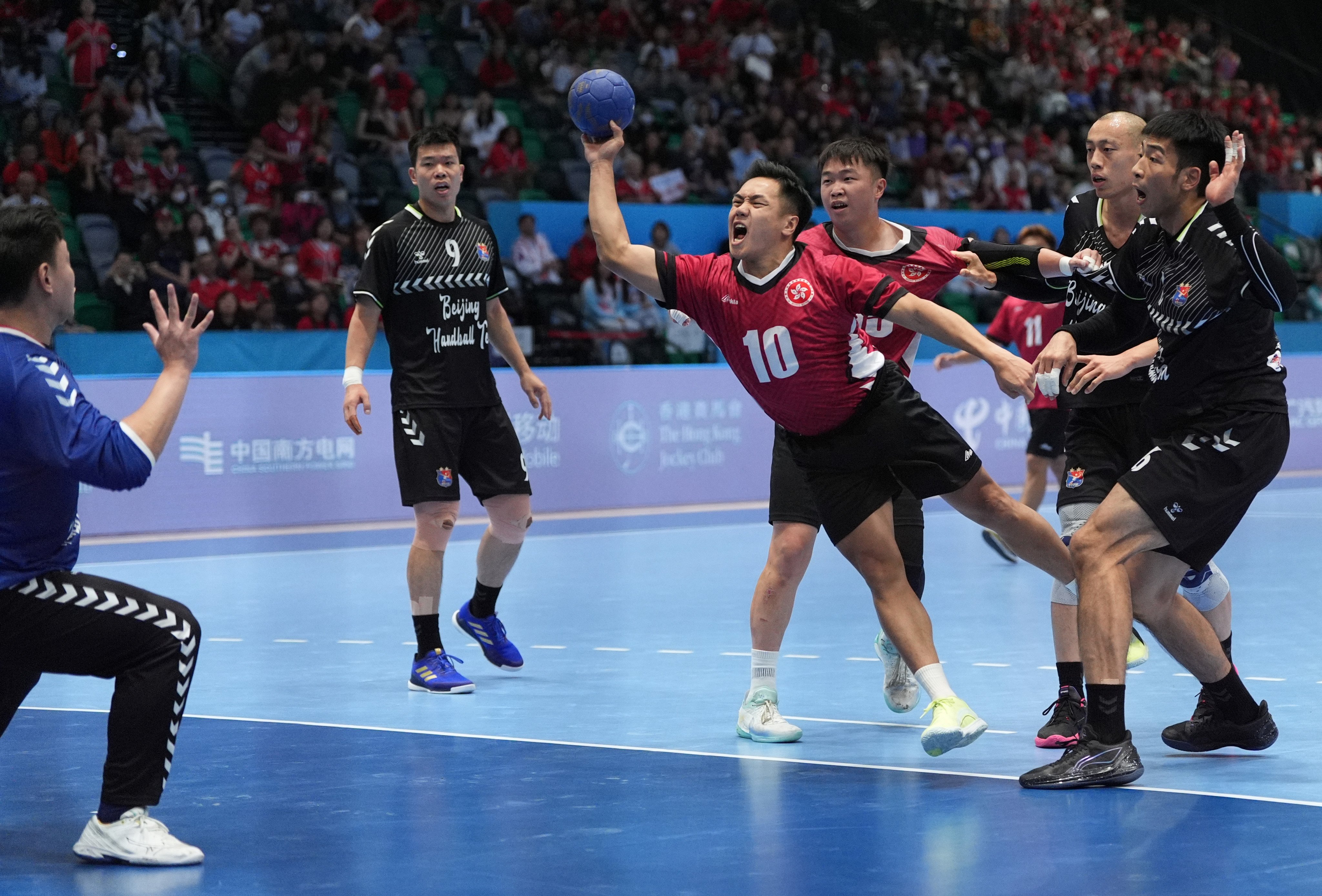 Freddie Tse (centre) believes the Hong Kong handball team’s recent run of results has increased recognition of the sport in the city. Photo: Eugene Lee