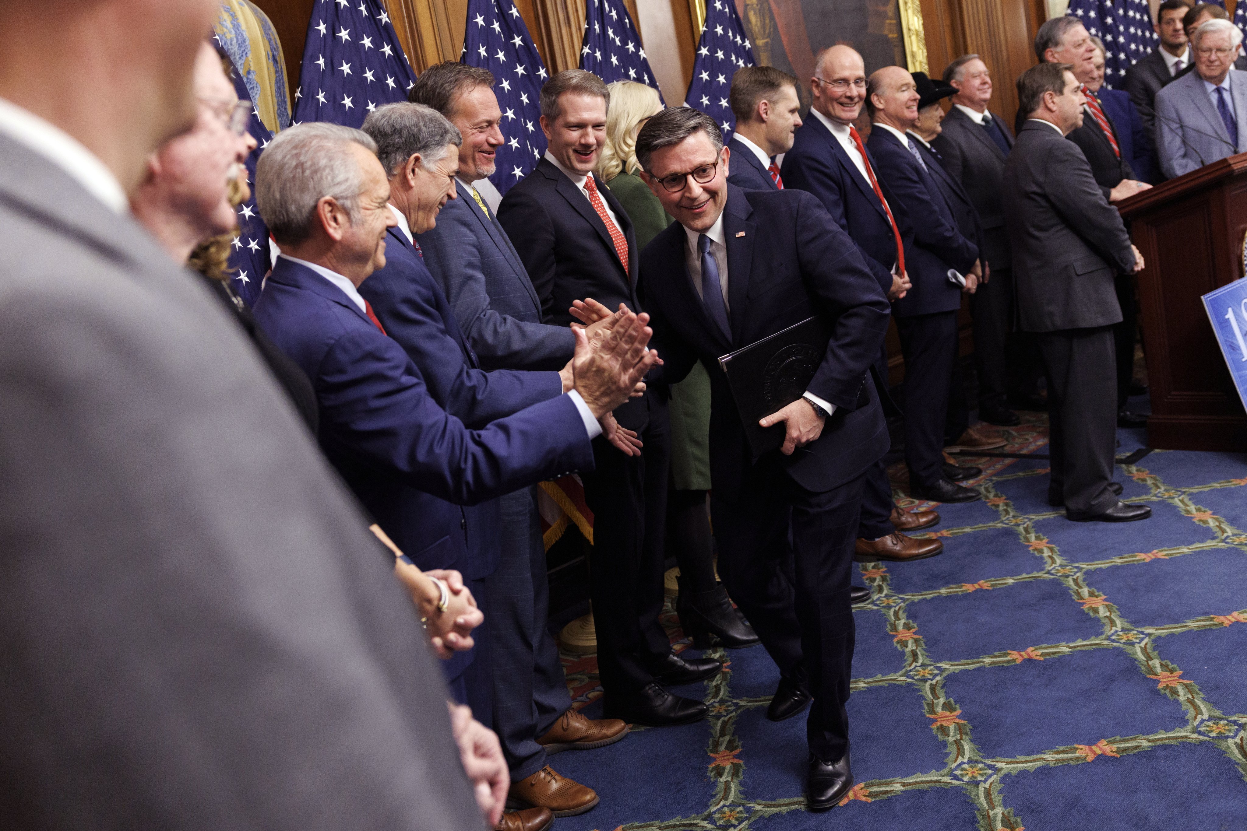 US House Speaker Mike Johnson high fives Republican lawmakers in Washington. Photo: EPA