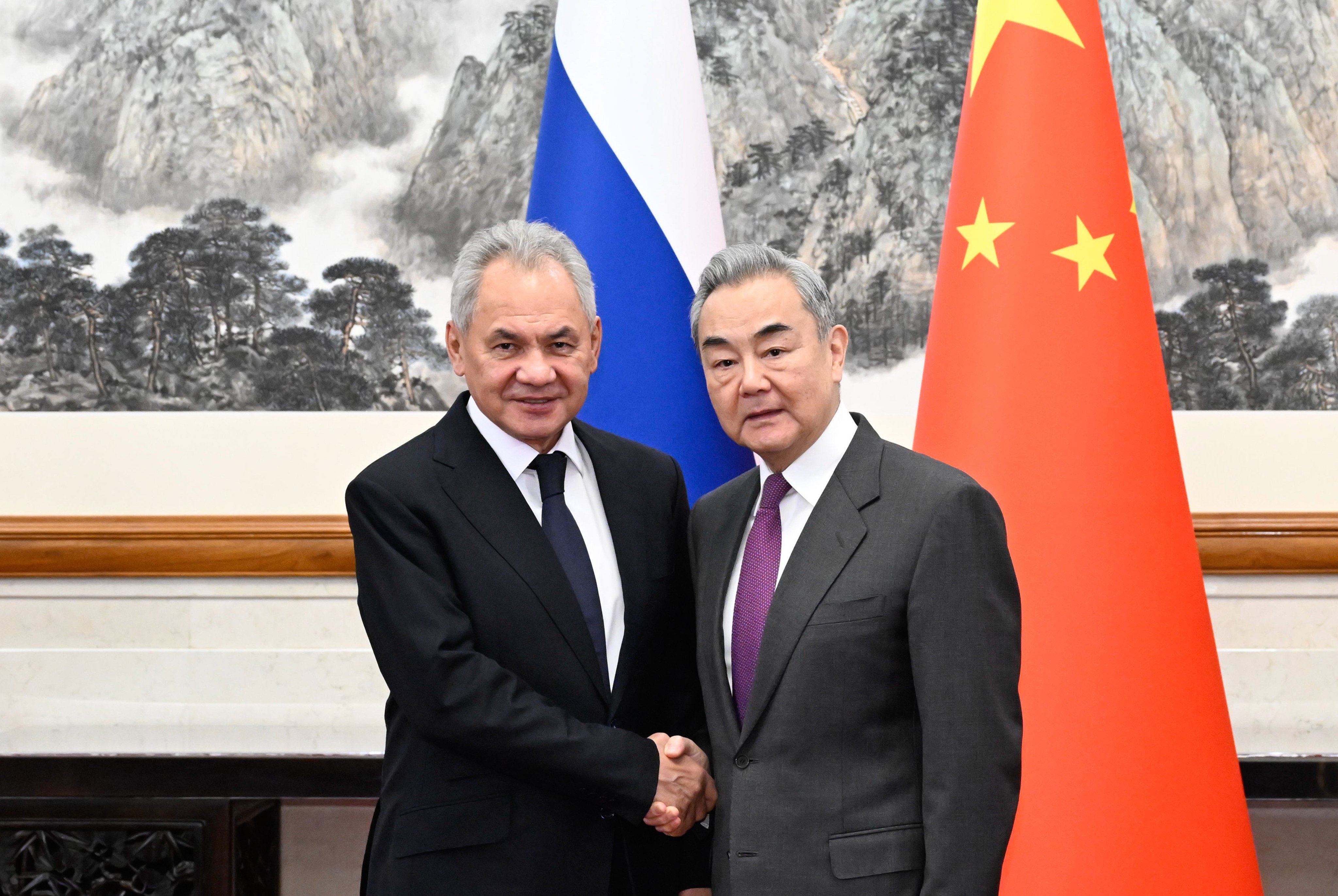 Wang Yi and Sergei Shoigu, pictured in Beijing on Sunday. Photo: Xinhua