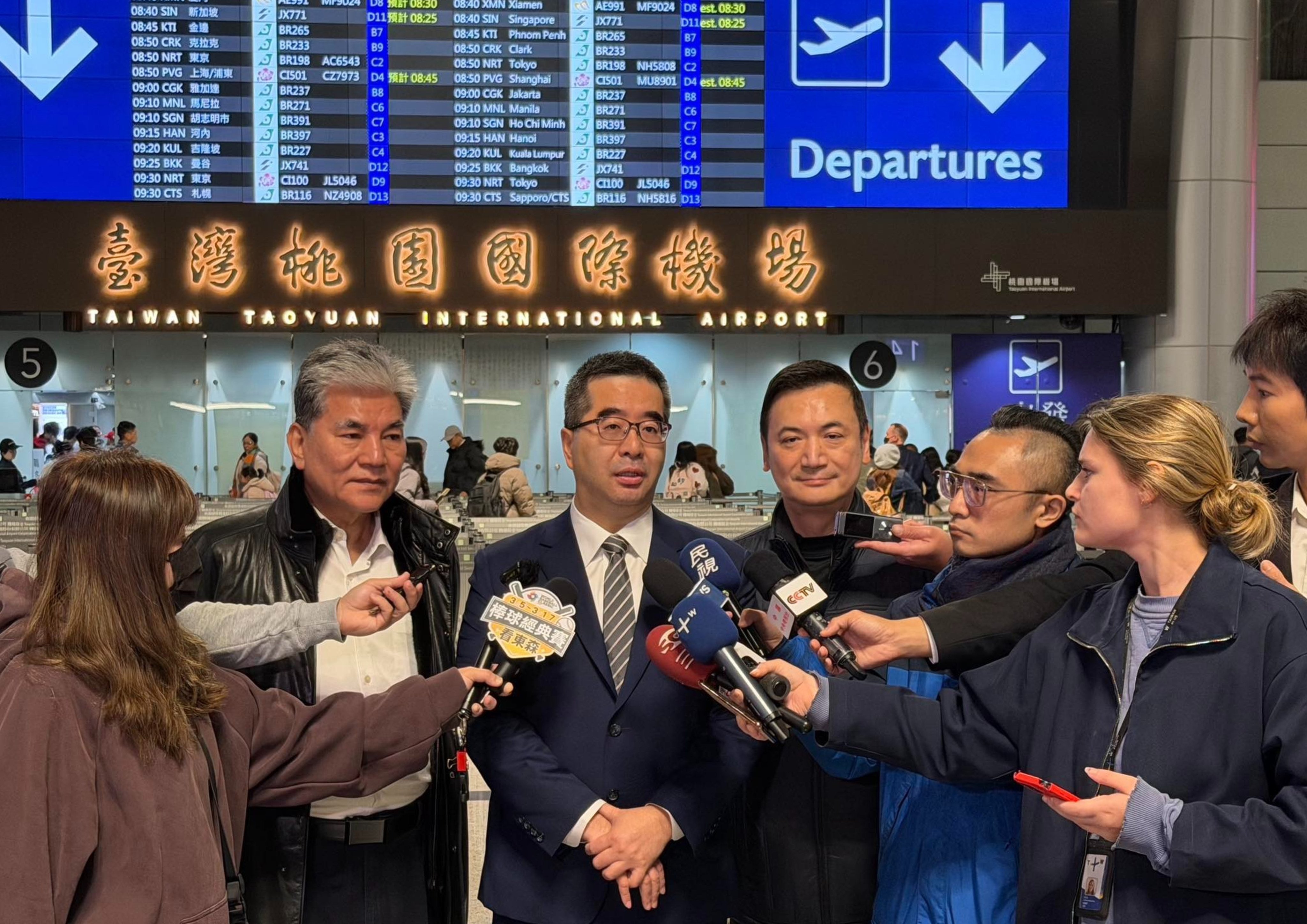 KMT vice-chairman Hsiao Hsu-tsen (centre) speaks to reporters at the airport in Taiwan on Monday before leaving for Beijing. Photo: Handout