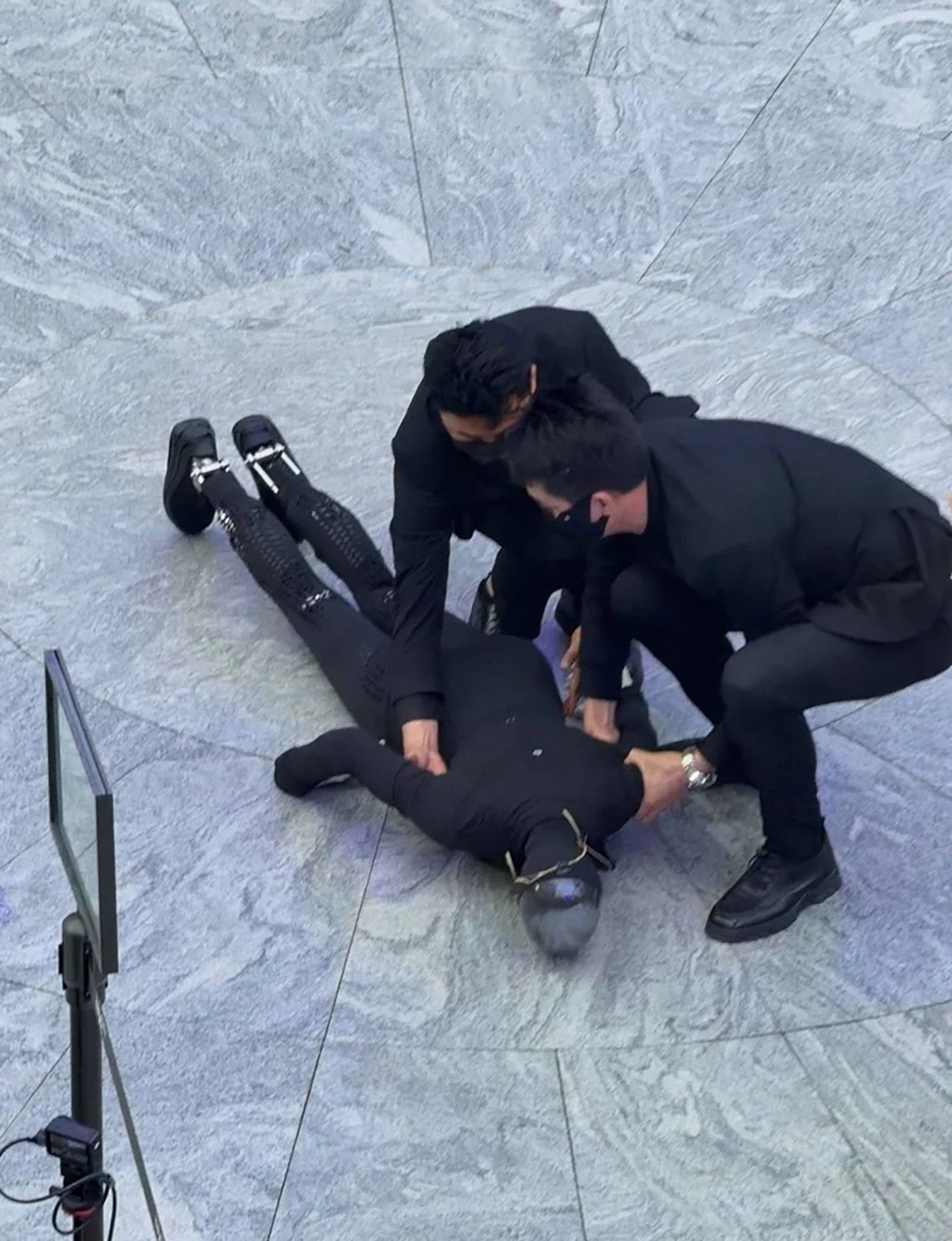 Staff members assist Xpeng’s Iron robot after its fall during a demonstration in Shenzhen. Photo: Handout