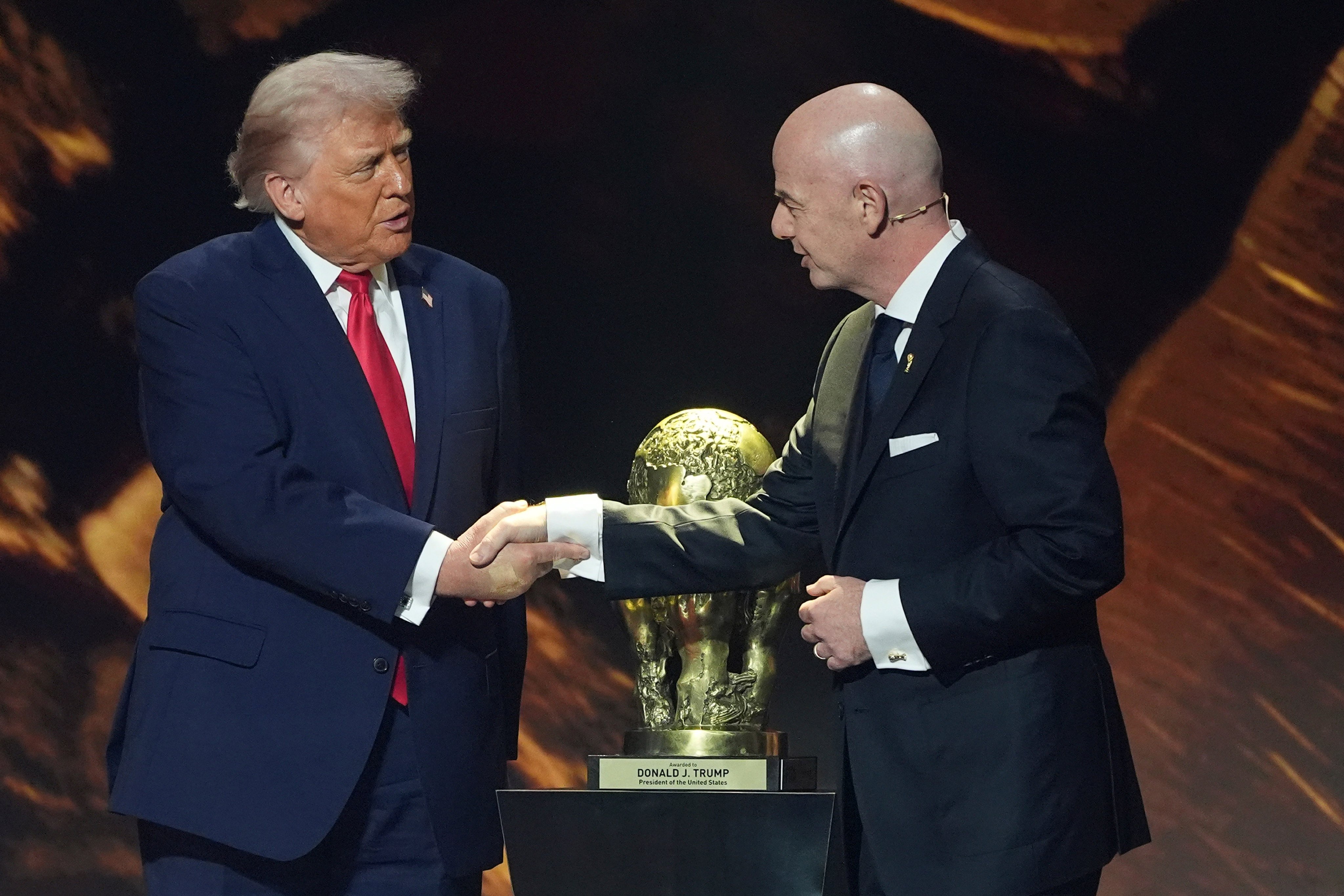US President Donald Trump, left, shakes hands with Fifa’s Gianni Infantino as he is presented with the inaugural Fifa Peace Prize, at the Kennedy Centre in Washington on December 5. Photo: AP