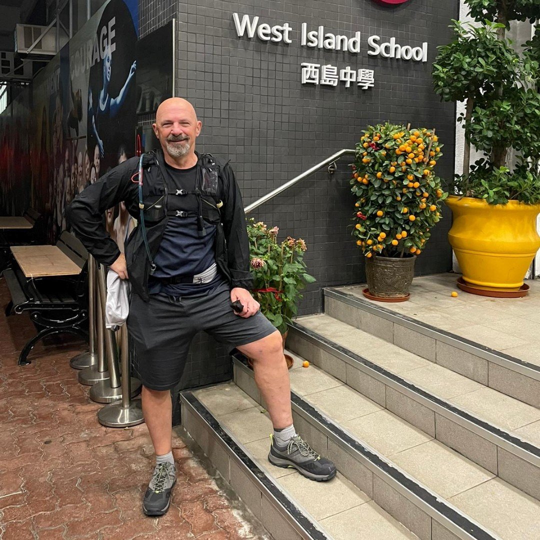Tony Bruno pauses in front of West Island School during the first Weez Walk, which he completed on his own, in 2021. He launched Weez Walk to raise funds for mental health support in Hong Kong to honour the memory of his son. Photo: weezproject.com