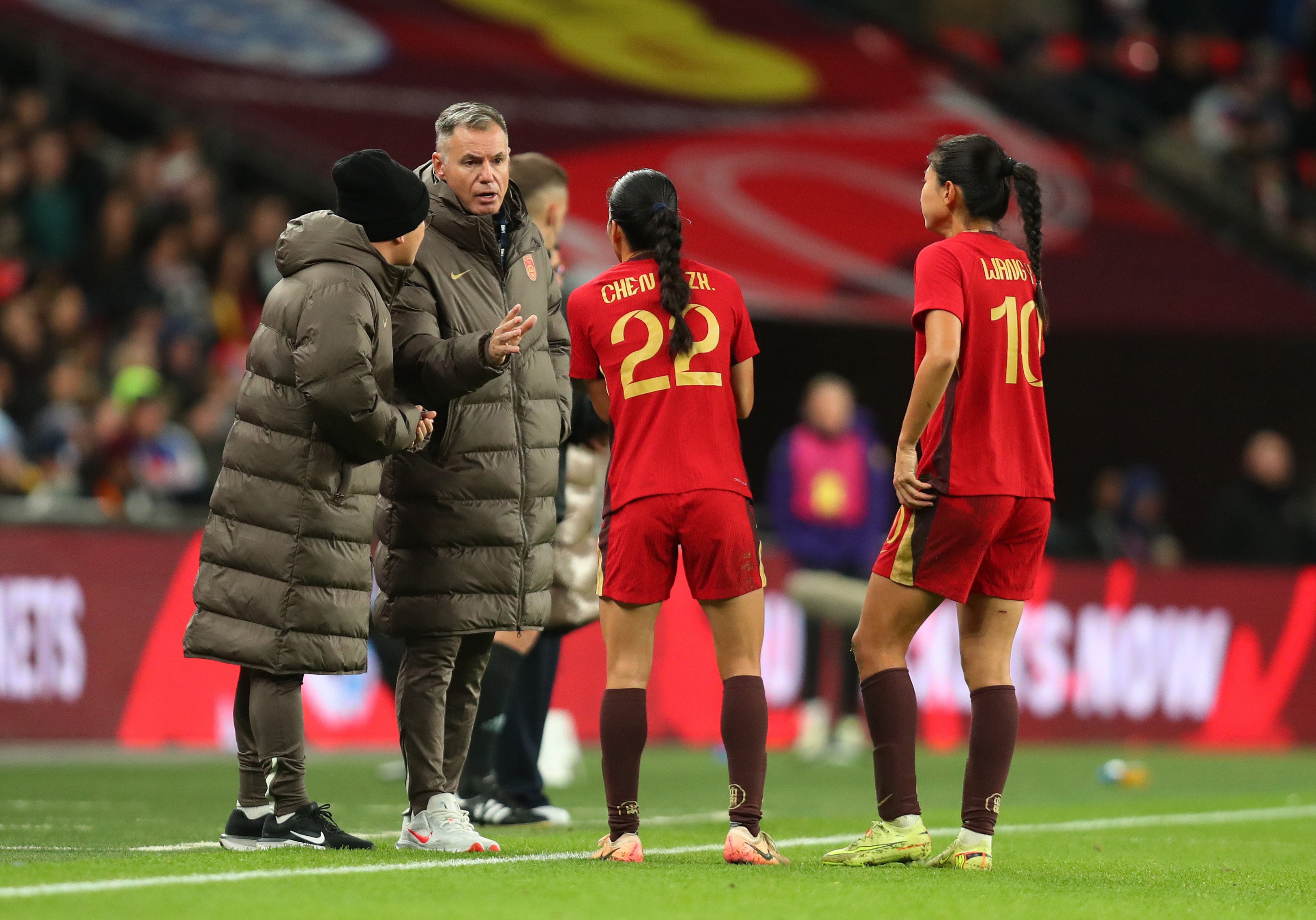 China coach Ante Milicic (middle) gives instruction to players Chen Qiaozhu and Wang Yanwen during their friendly at Wembley Stadium against England last Novemeber. China lost 8-0. Photo: Getty Images