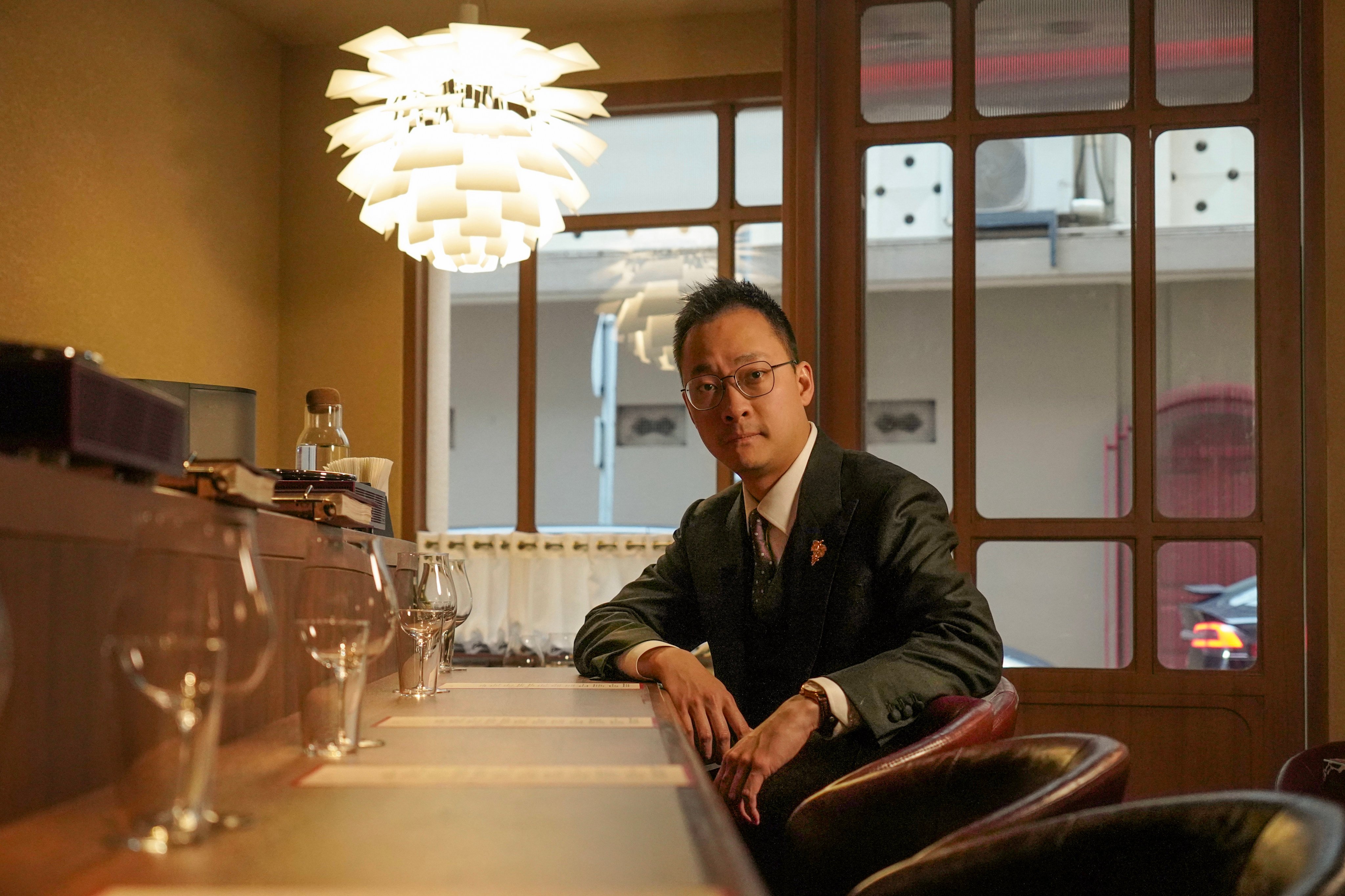 Sommelier Mason Ng Yin-song poses for a photo at wine bar Maison Natsukashii in Central. 31JAN26 SCMP / Karma Lo
