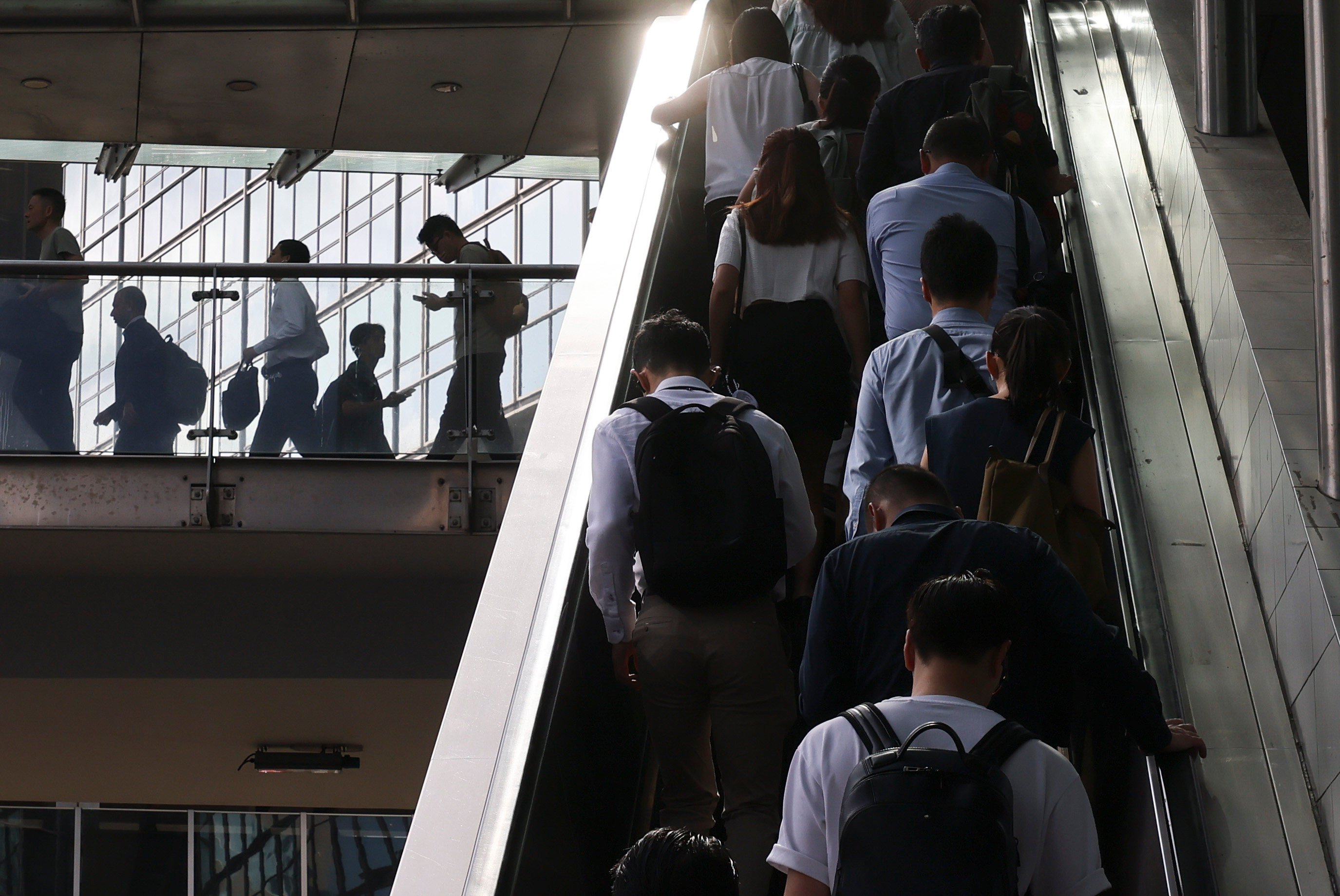 People go to work in Central district during the morning rush hour on July 17. University graduates in Hong Kong are facing the gloomiest employment market since 2021. Photo: Nora Tam