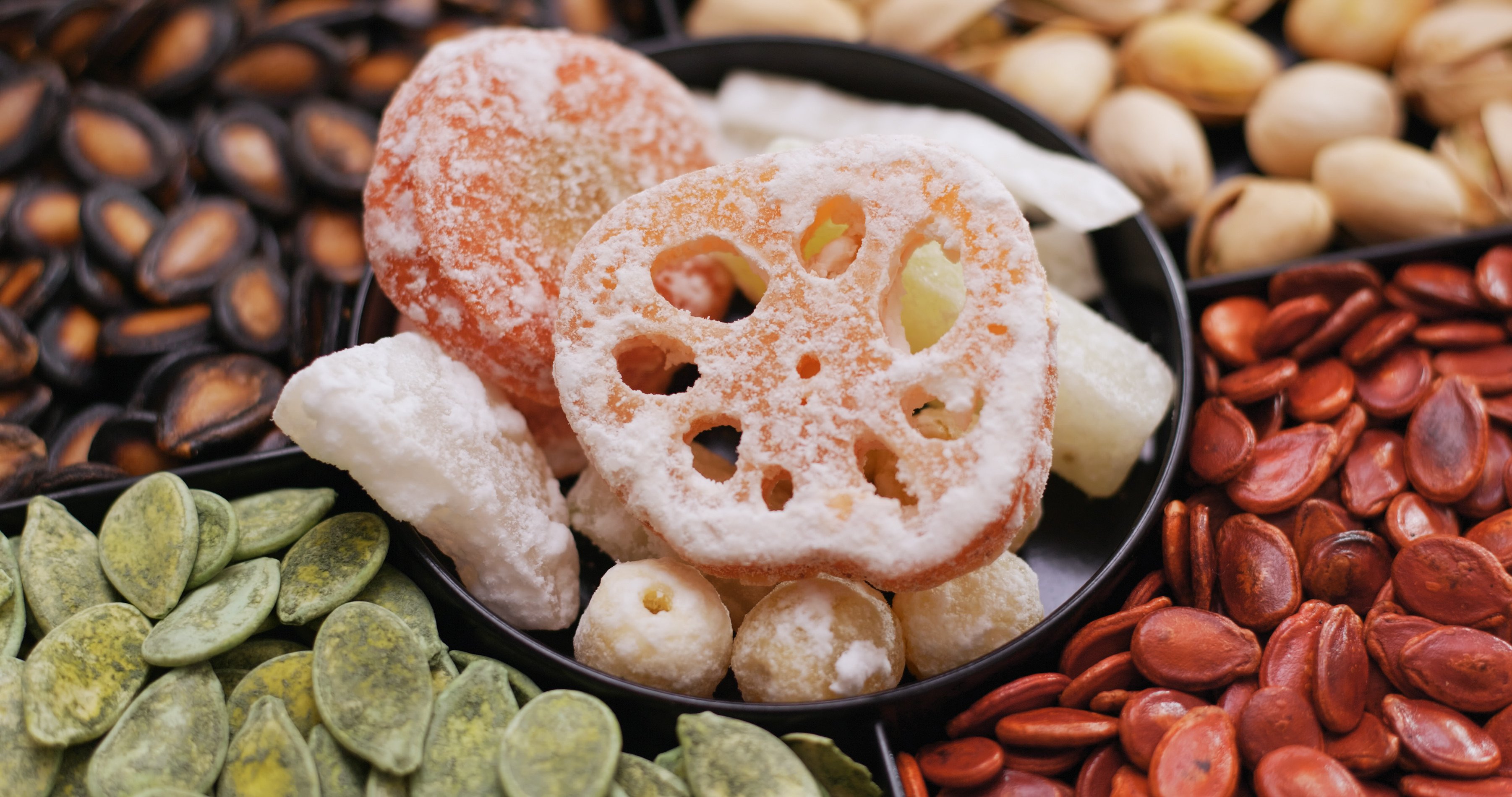 A tray of Lunar New Year snacks. Many Chinese communities enjoy the same festive favourites at this time of year, but places such as Singapore and Malaysia also gorge on regional treats shaped by foreign influences and migration. Photo: Getty Images