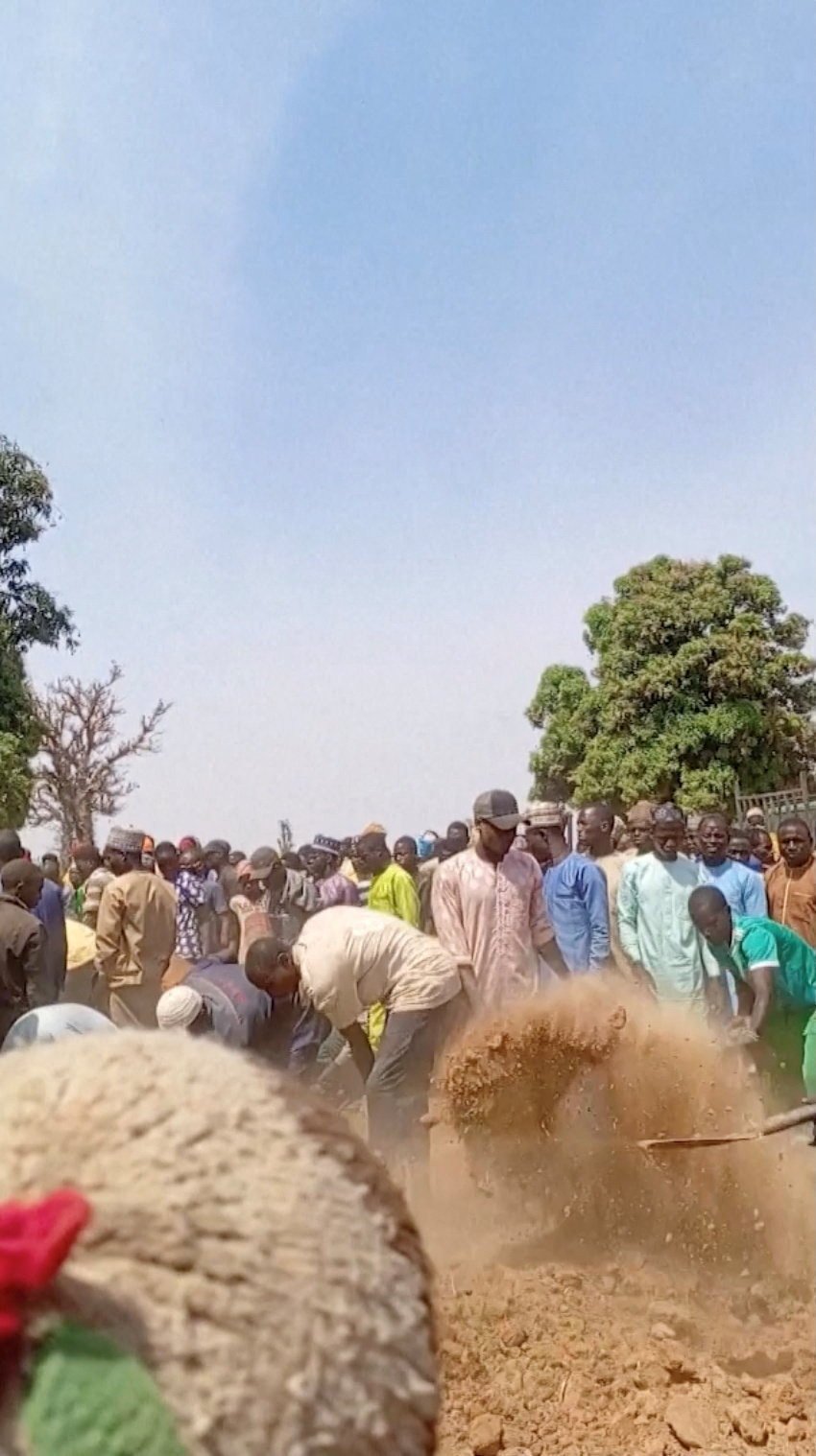 People dig graves after a deadly attack by an armed gang in Katsina, Nigeria. Photo: Reuters TV