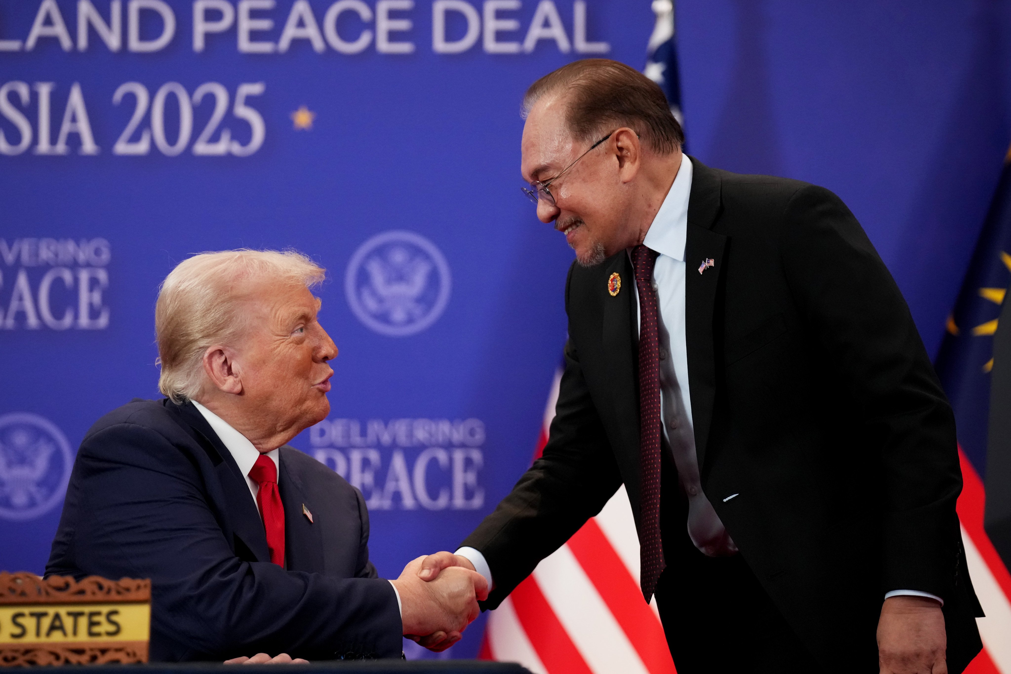 US President Donald Trump (left) and Malaysian Prime Minister Anwar Ibrahim shake hands during the signing of a Cambodia-Thailand peace deal In Kuala Lumpur in October 2025.
Photo: Getty Images