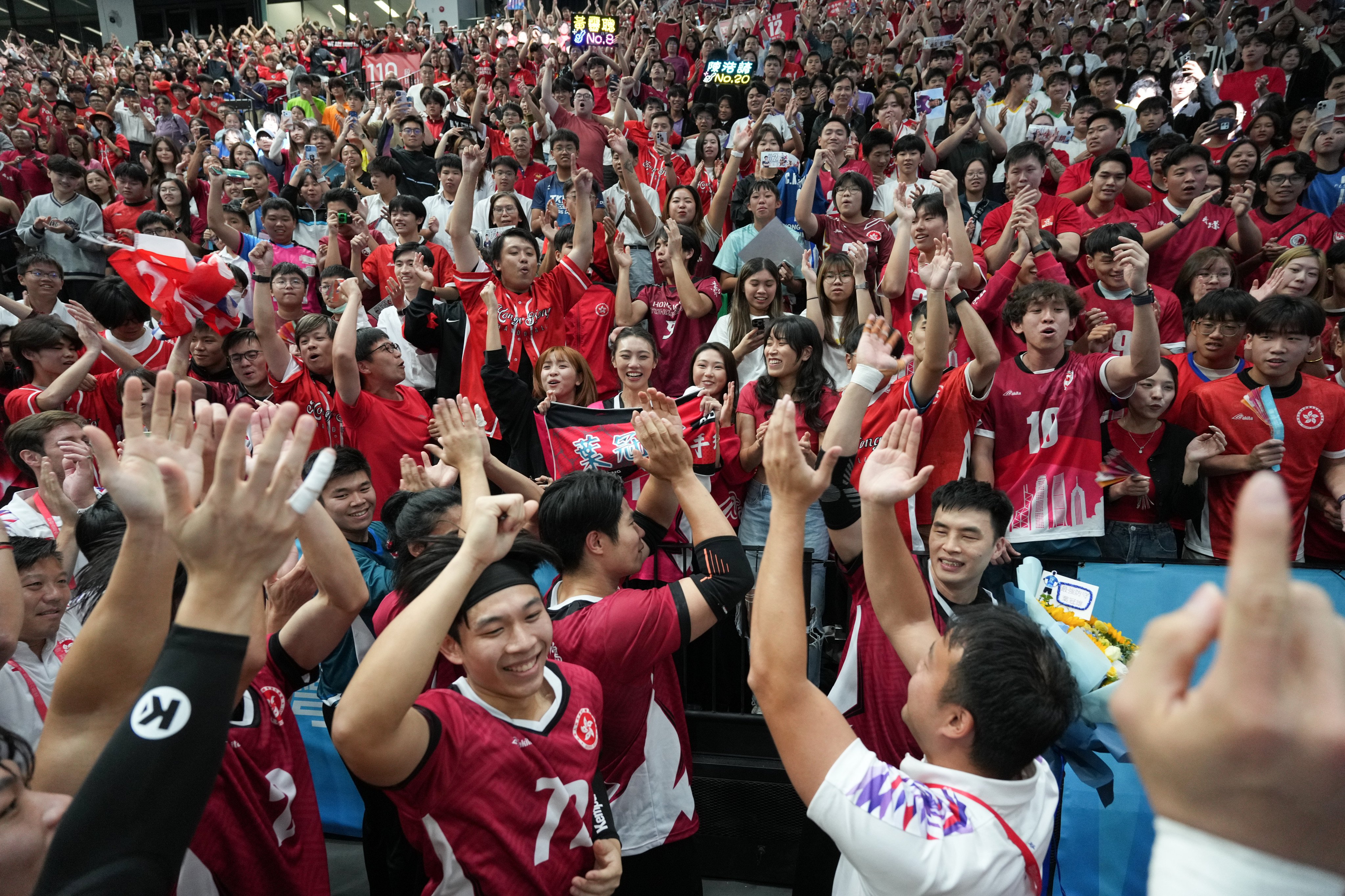 Hong Kong;s men celebrate with fans at Kai Tak Arena after a National Games clash with Beijing. Photo: Eugene Lee