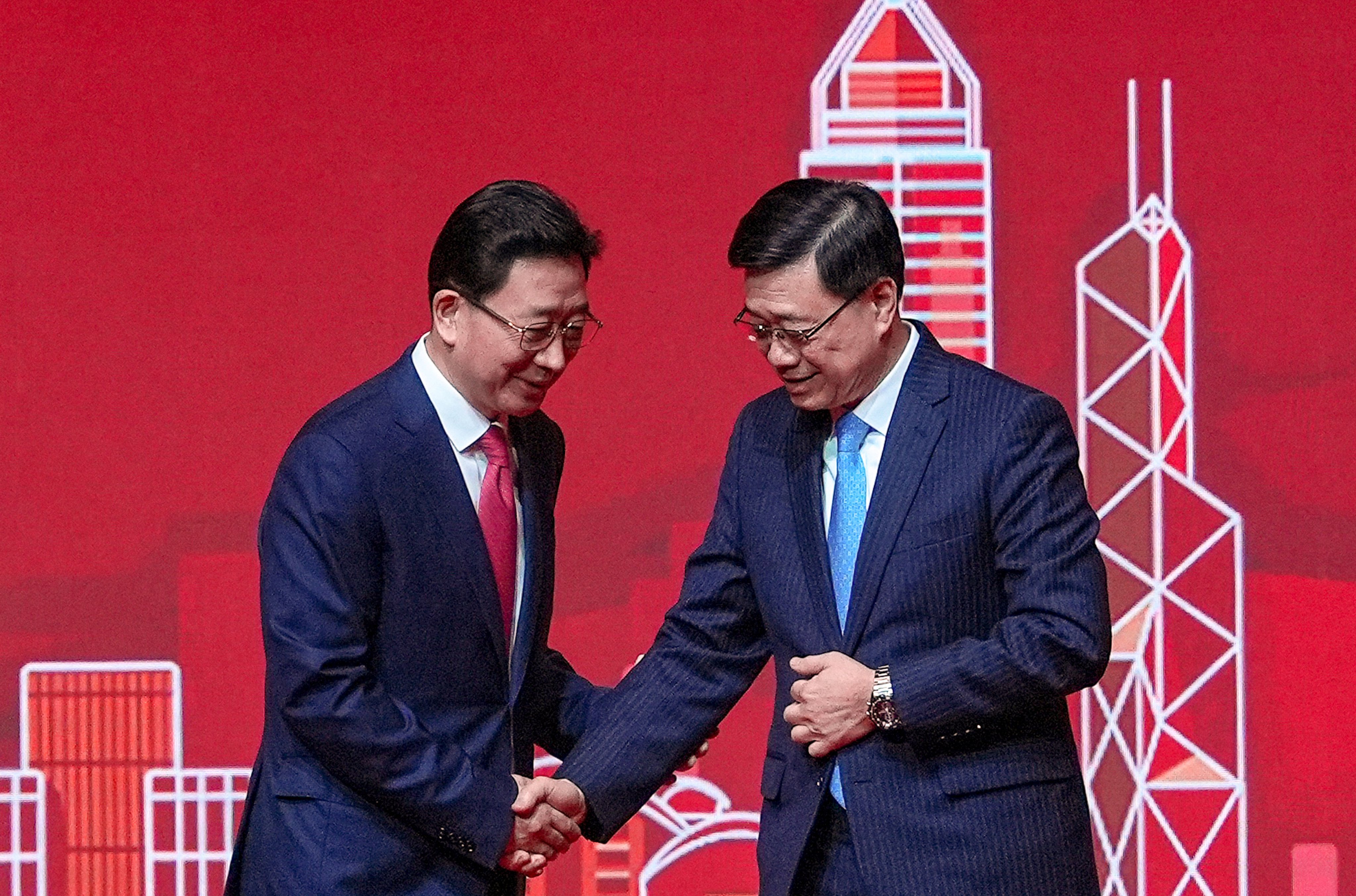 Liaison office director Zhou Ji (left)  with Chief Executive John Lee at the Lunar New Year reception. Photo: Elson Li