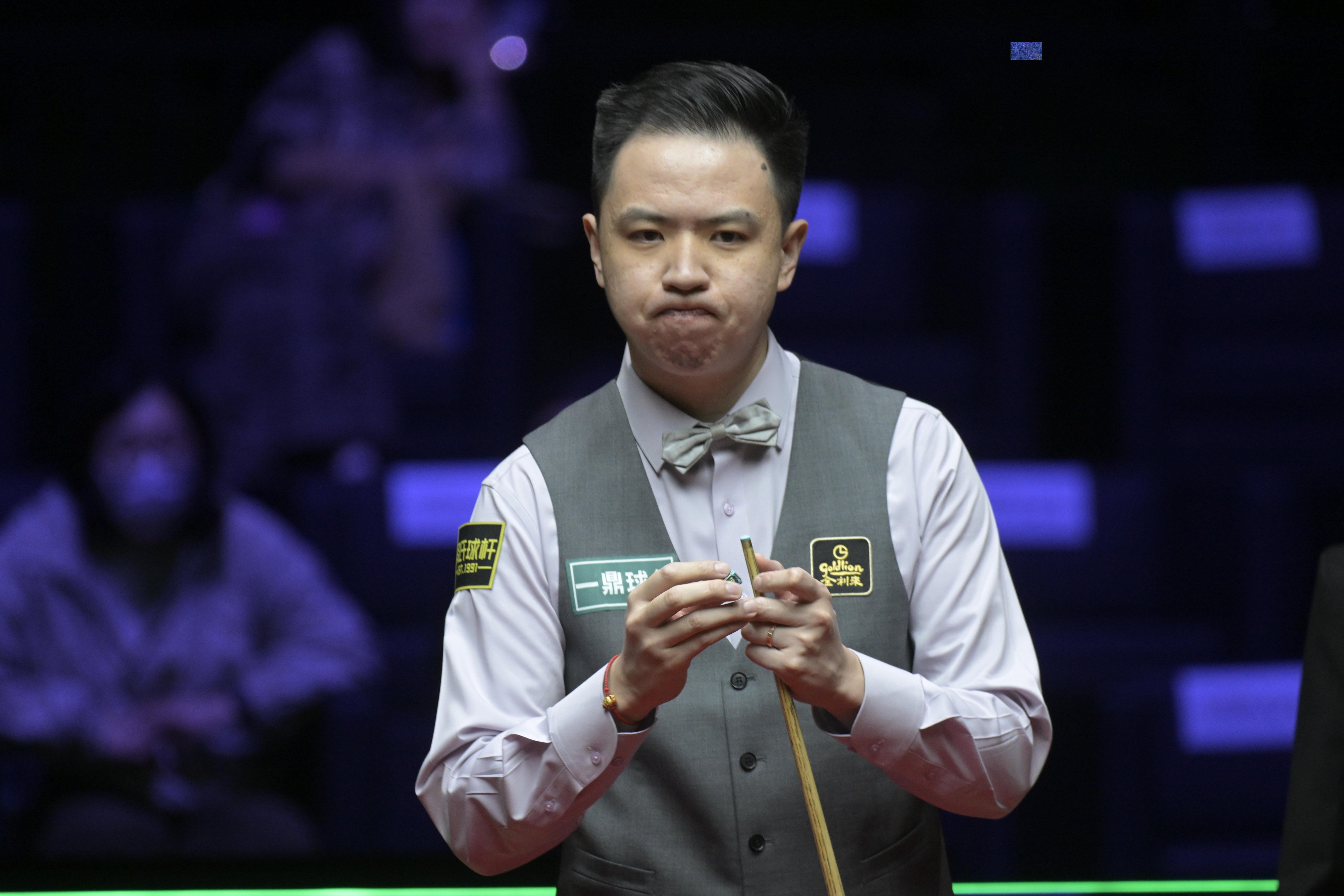 China’s Xiao Guodong in between shots in a second-round World Grand Prix match against Ronnie O’Sullivan of England at Kai Tak Arena on Thursday. Photo: Xinhua