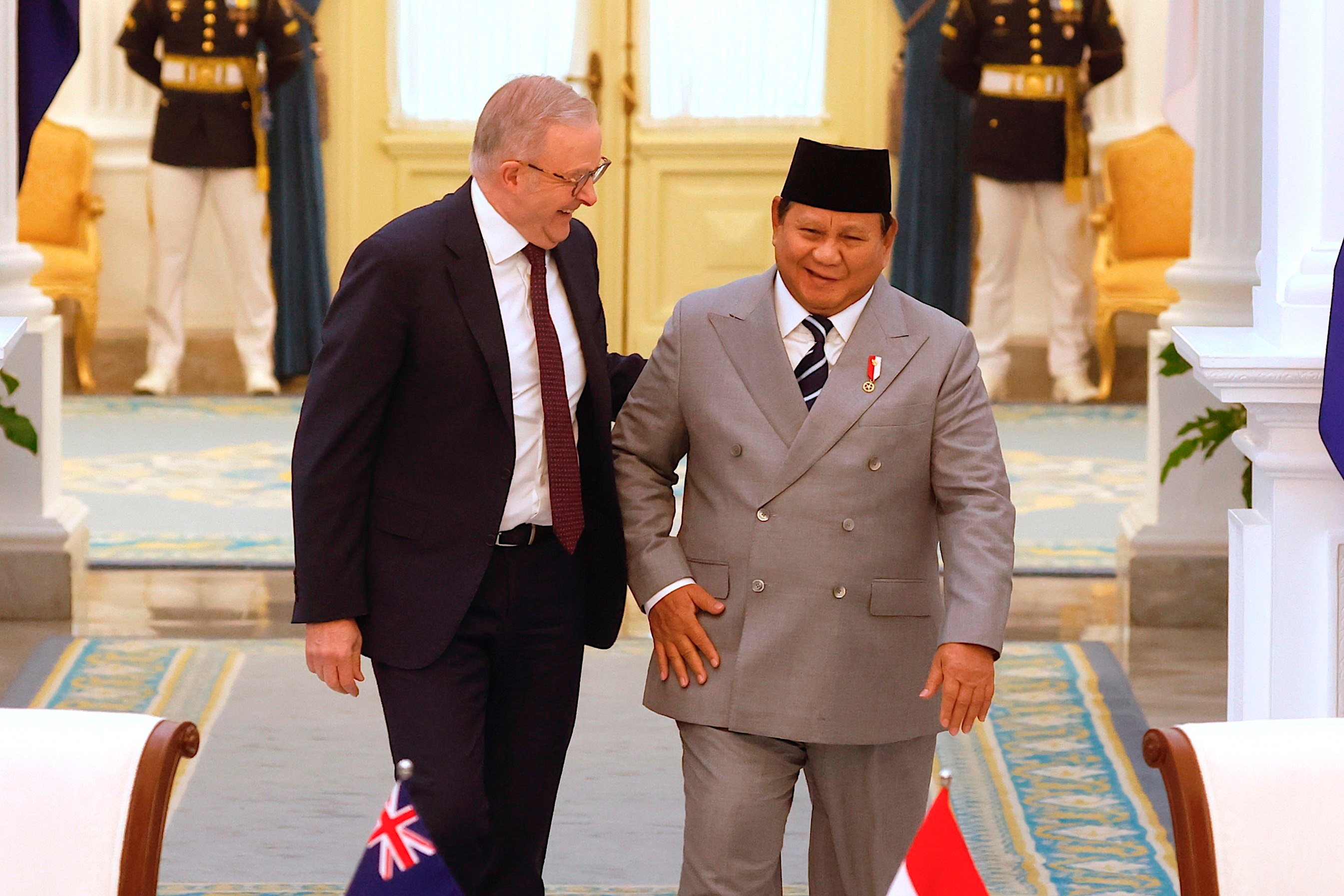 Australia’s Prime Minister Anthony Albanese (left) chats with Indonesia’s President Prabowo Subianto as they walk to their meeting at Merdeka Palace in Jakarta on Friday. Photo: EPA