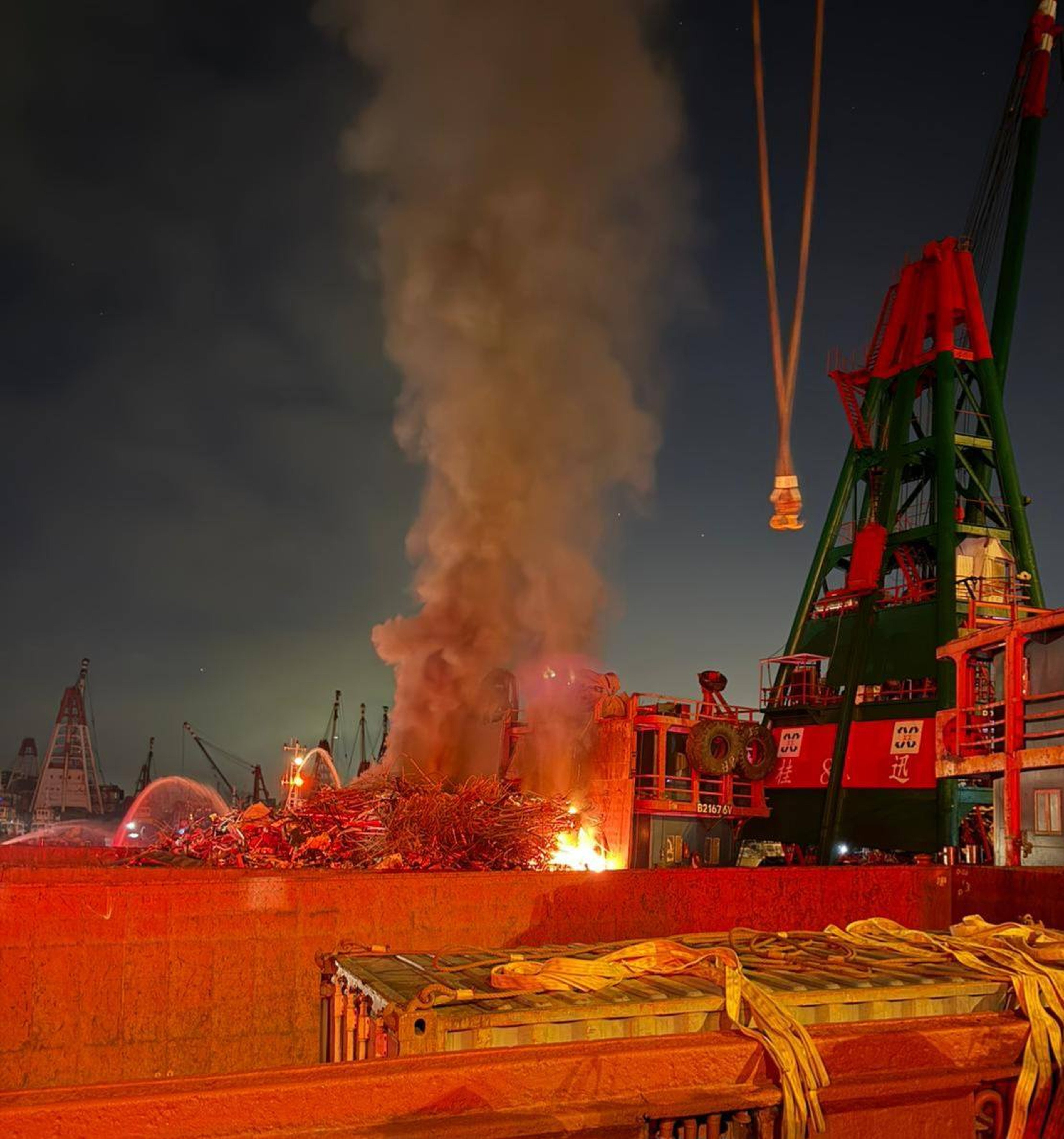 A barge carrying scrap metal caught fire at the New Yau Ma Tei Public Cargo Working Area in Hong Kong early on Friday. Photo: Handout