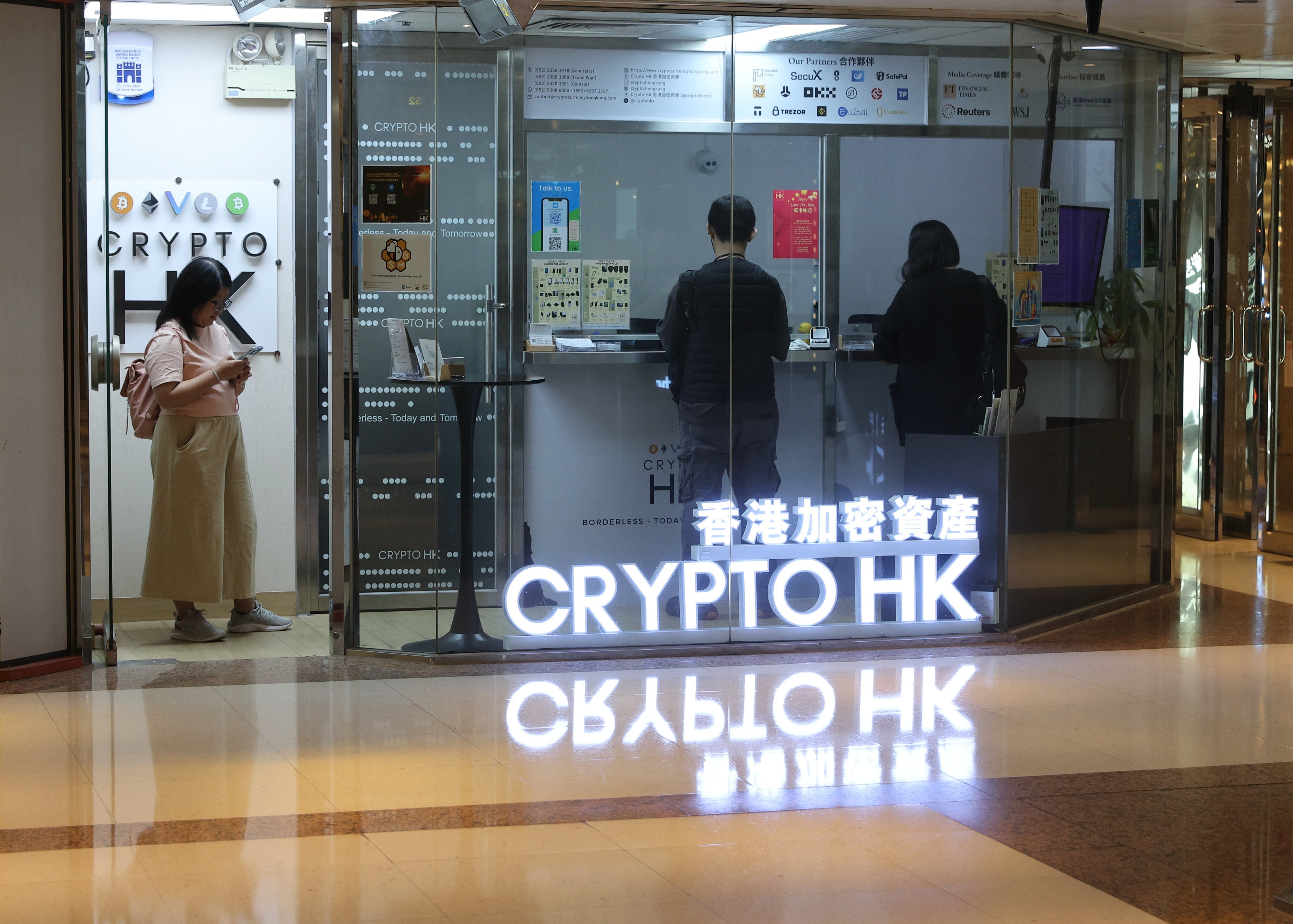 People visit a cryptocurrency shop in Admiralty. Photo: Edmond So