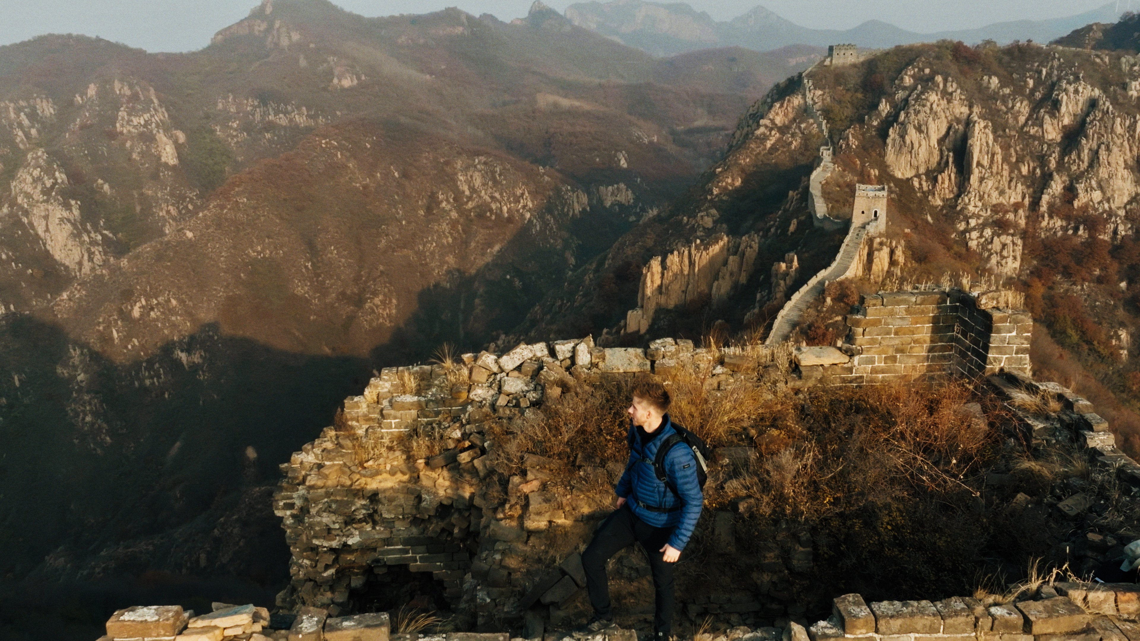 Ash Dykes walks along the Great Wall of China in a still from his new BBC series, The Great Wall with Ash Dykes. Photo: Bomanbridge Media