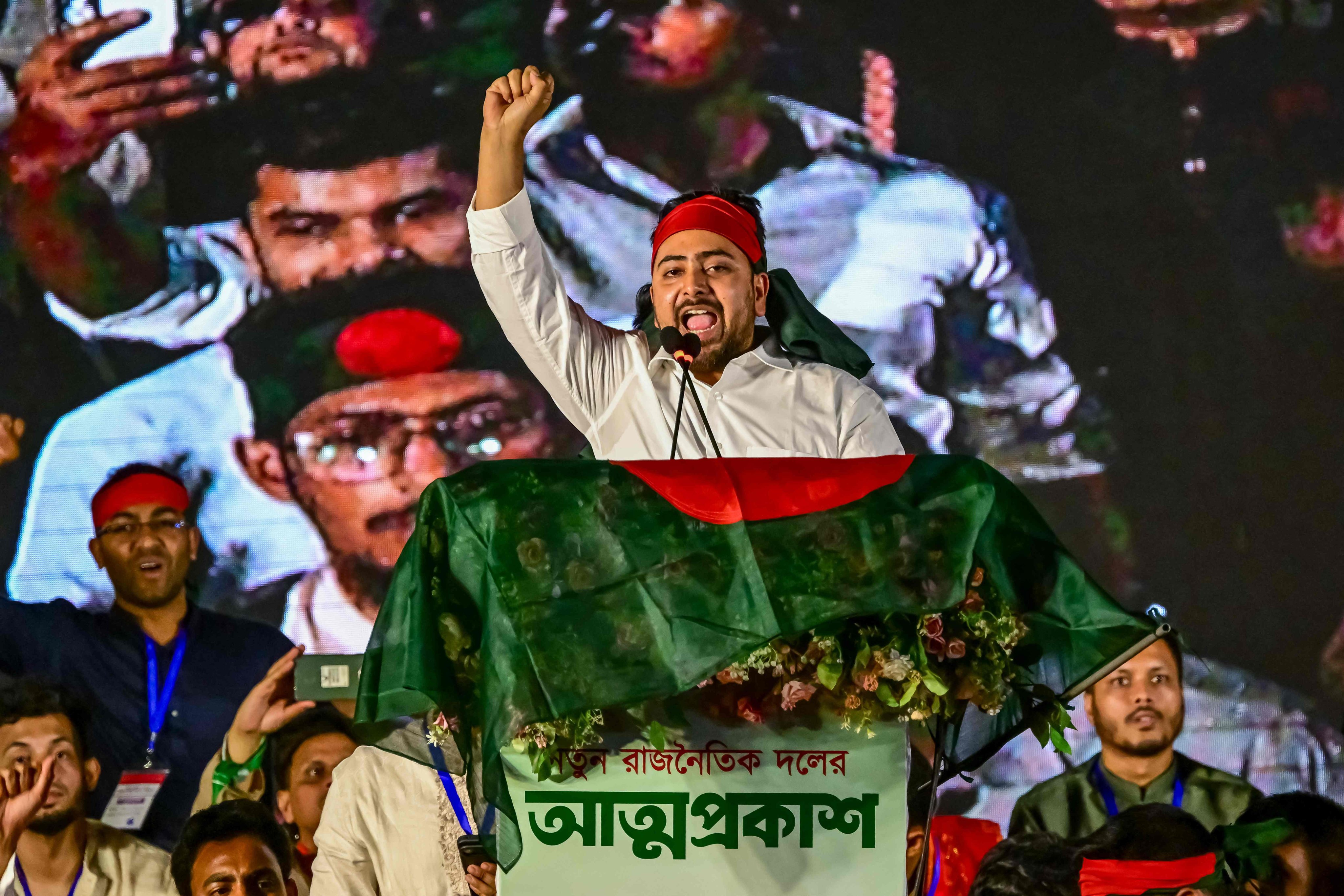 (FILES) Nahid Islam, convener of the newly formed Jatiya Nagarik Party or National Citizen's Party shouts slogans as he speaks during the launch of the new political party by students in Dhaka on February 28, 2025. Bangladesh has been in political turmoil since a student-led revolt overthrew former prime minister Sheikh Hasina in August 2024, ending her 15-year autocratic rule. The Muslim-majority nation of 170 million people will hold its first elections since the uprising on February 12, 2026. (Photo by Munir UZ ZAMAN / AFP)