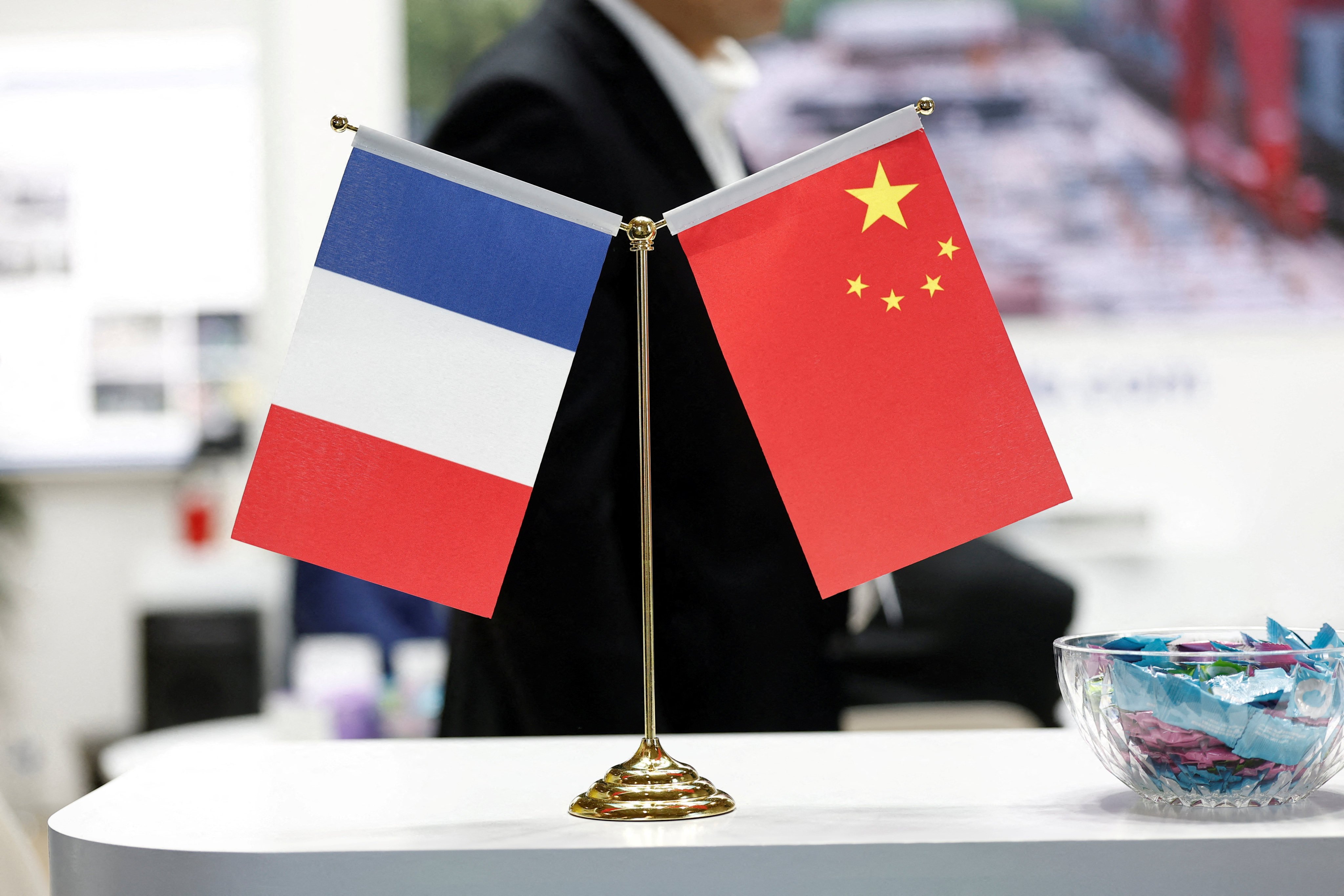 The flags of France and China. On Thursday, two Chinese nationals suspected of trying to intercept satellite communications from ‌a French Airbnb were places under formal investigation. Photo: Reuters