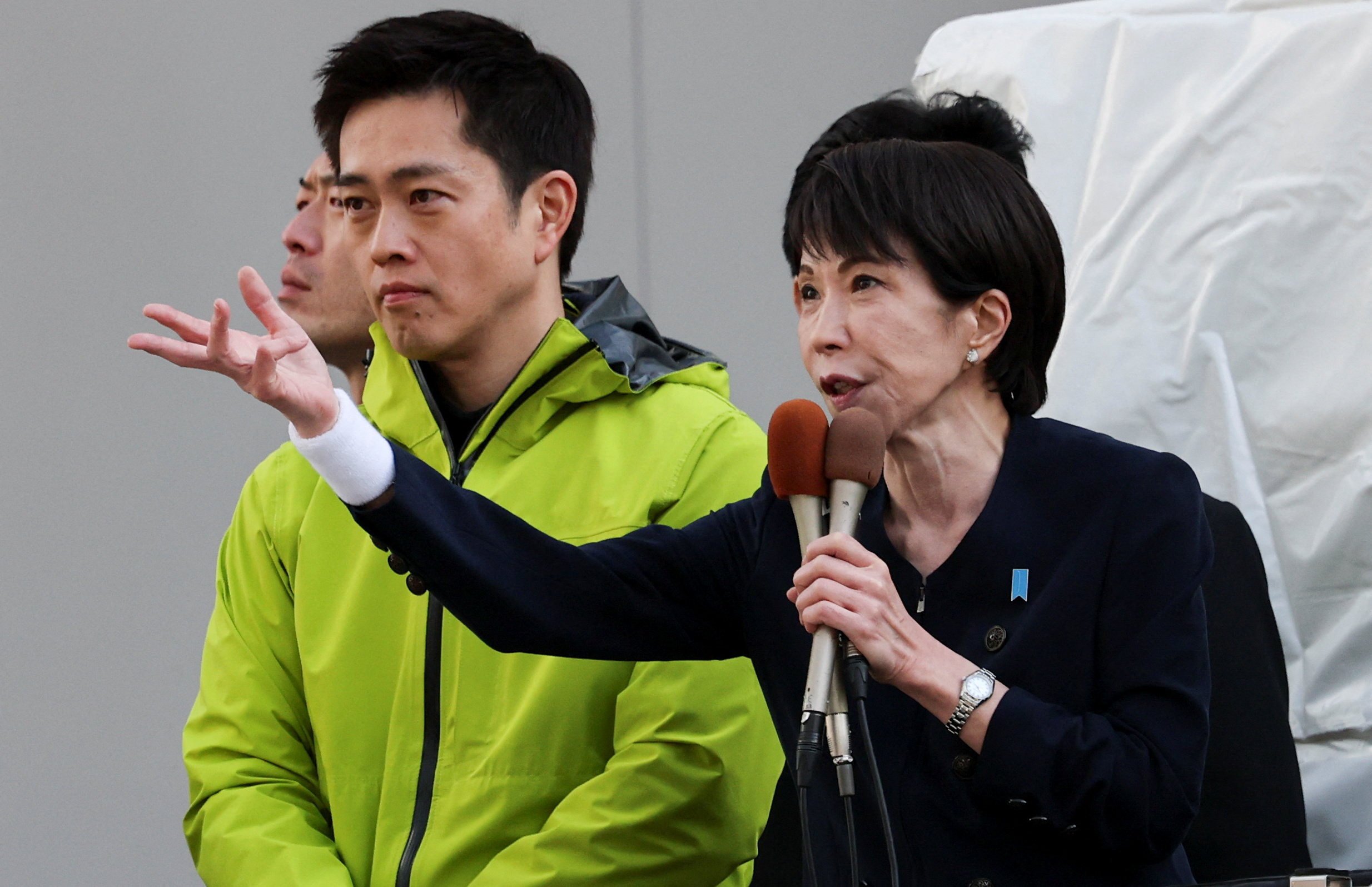 Sanae Takaichi, Japan's Prime Minister and leader of the ruling Liberal Democratic Party (LDP), speaks next to Hirofumi Yoshimura, Japan Innovation Party leader, at an election campaign event on the first day of campaigning for the February 8 snap election, in Tokyo, Japan, January 27, 2026. REUTERS/Kim Kyung-Hoon