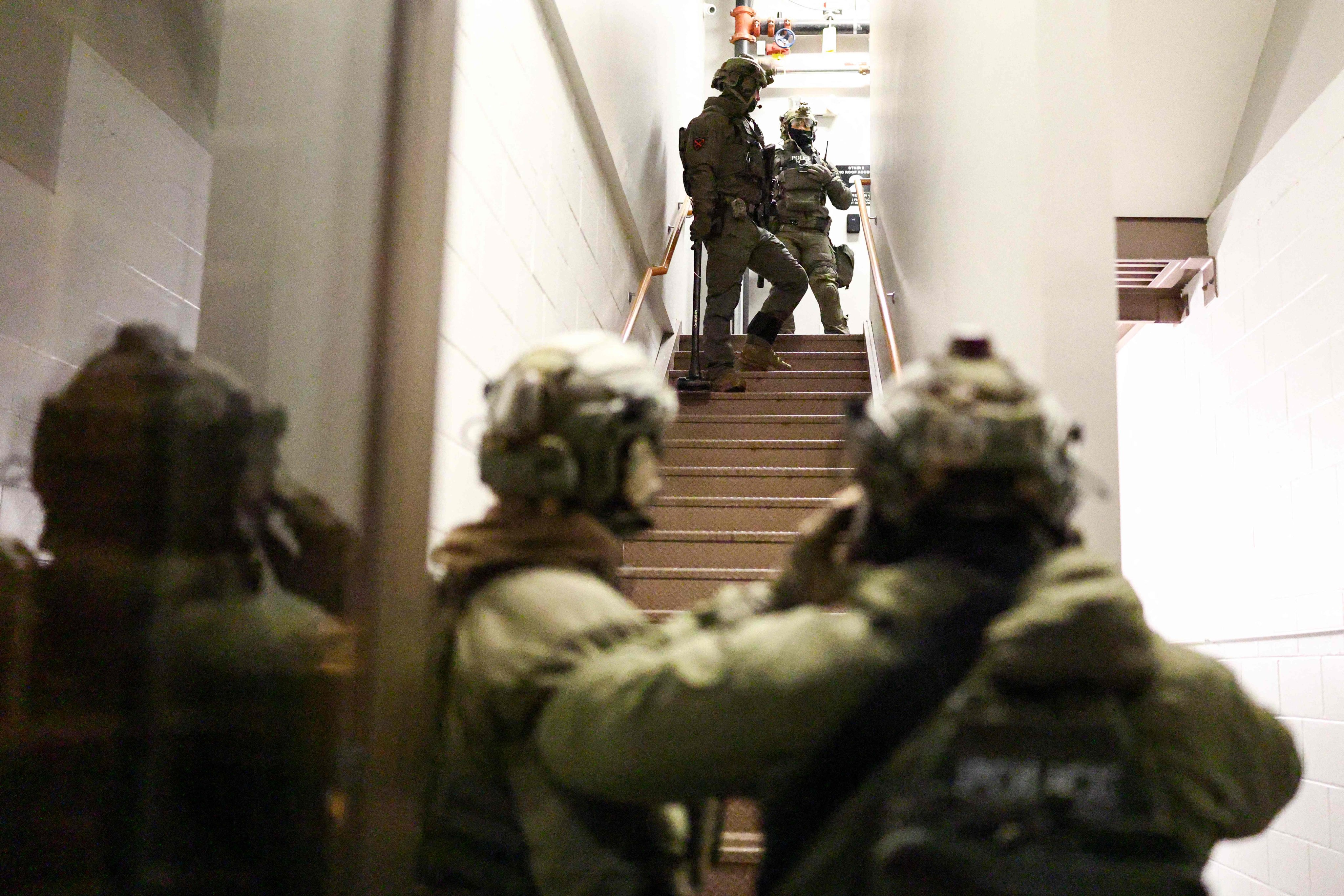 US federal agents enter a residential building in Minneapolis, Minnesota, on Thursday. Photo: AFP