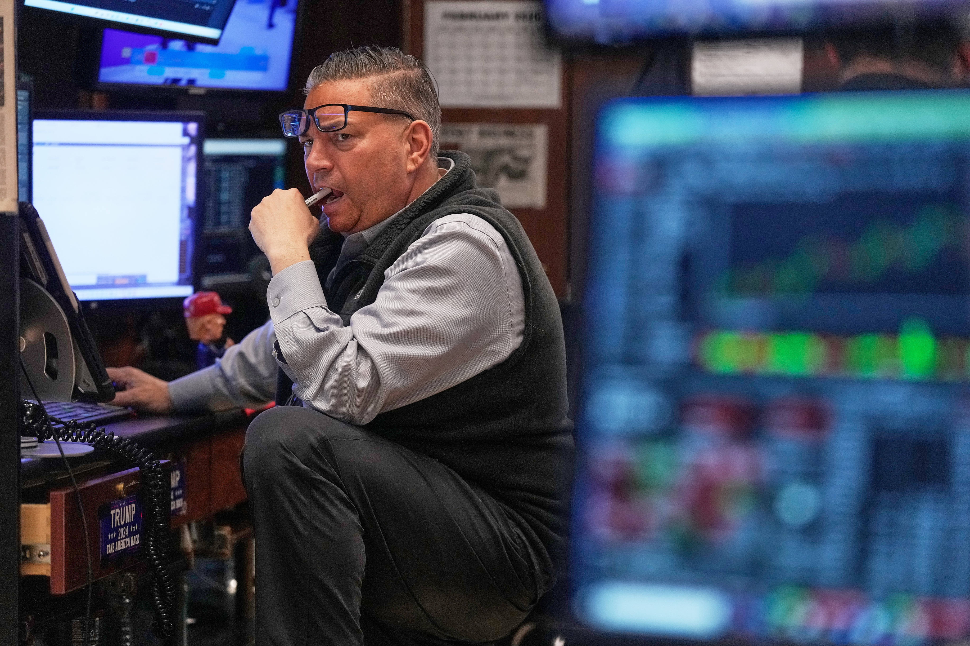Trader Jonathan Mueller bites on his pen as he works on the floor of the New York Stock Exchange on February 5, 2026. Photo: AP Photo