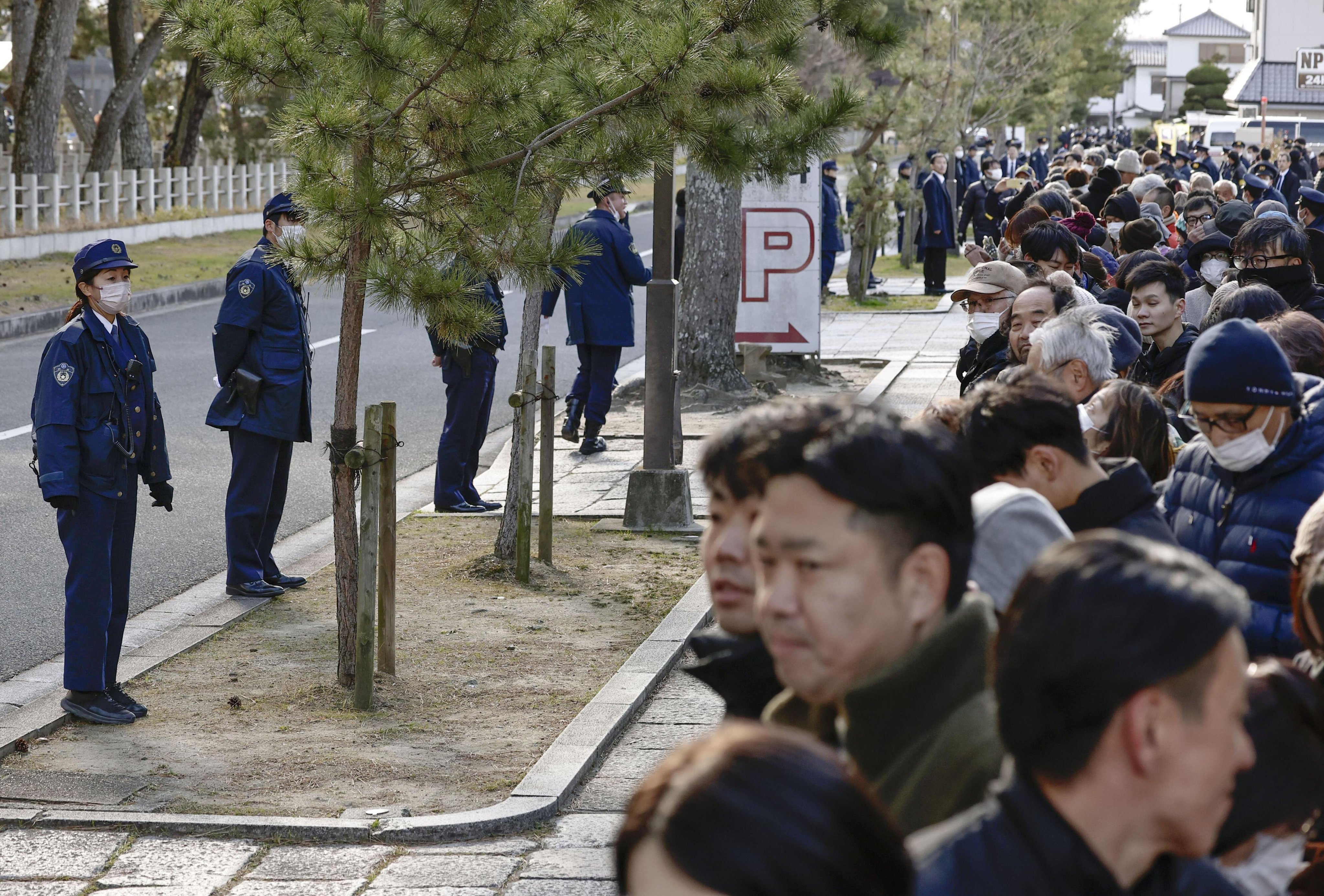 Police officers stand guard near the Horyuji Temple in Ikaruga, Nara prefecture on January 14. Photo: Kyodo/AP