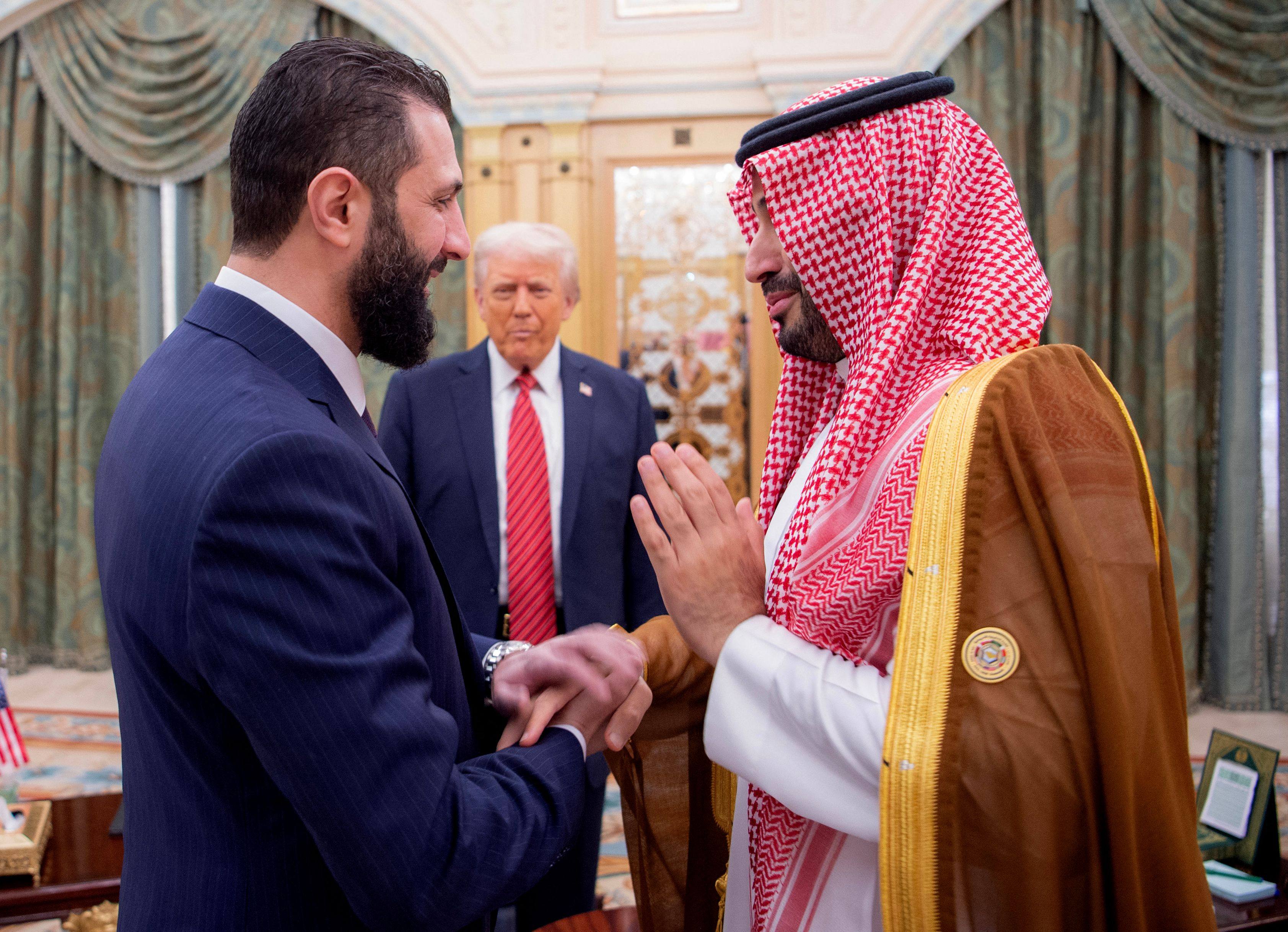 A handout picture provided by the Saudi Royal Palace shows Saudi Crown Prince Mohammed bin Salman (right) greeting Syria’s interim president Ahmed al-Sharaa as US President Donald Trump looks on, in Riyadh on May 14 last year. Photo: AFP