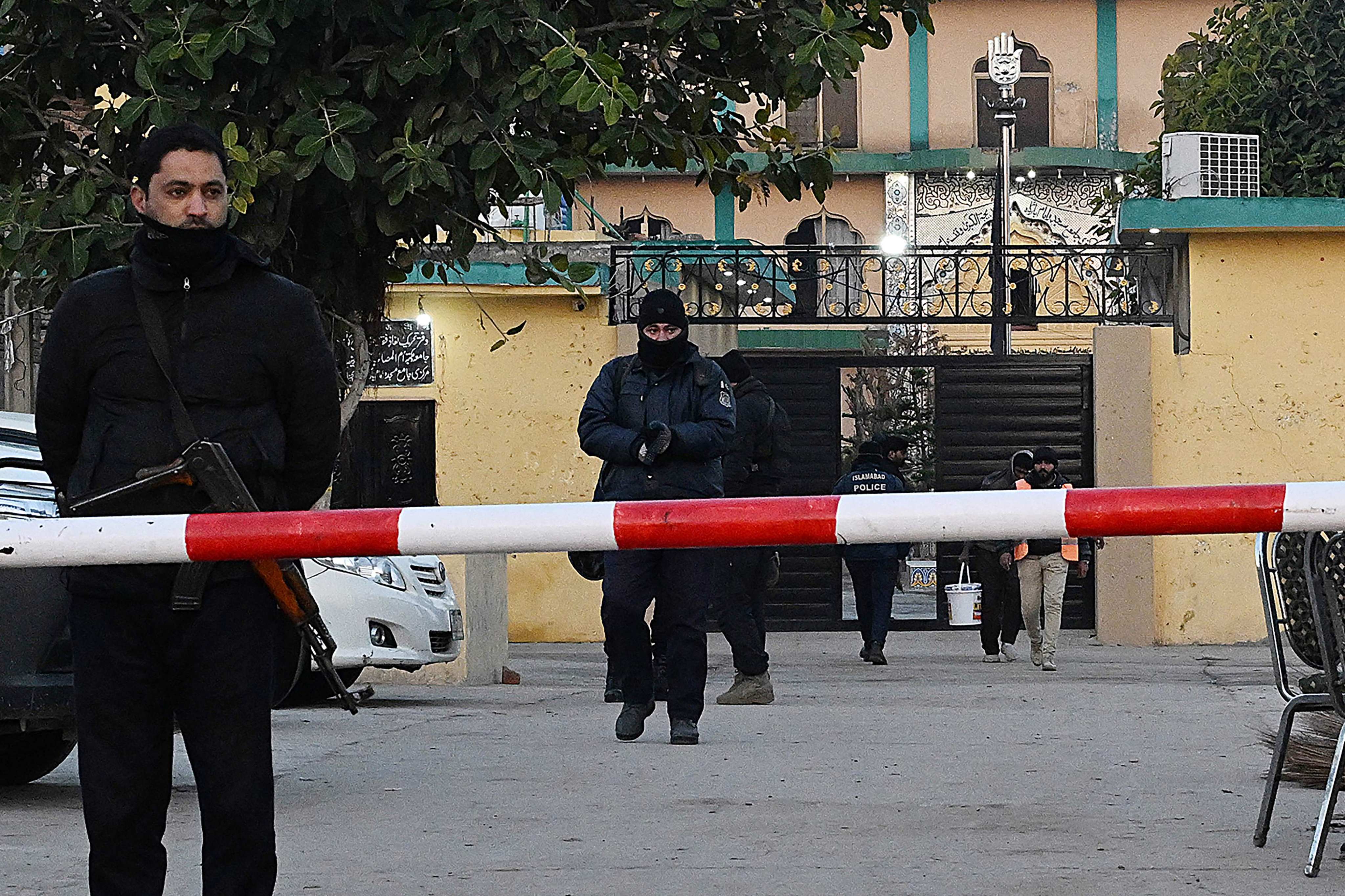 Police investigate the scene of Friday’s suicide bombing at a Shiite mosque in Islamabad on Saturday. Photo: AFP
