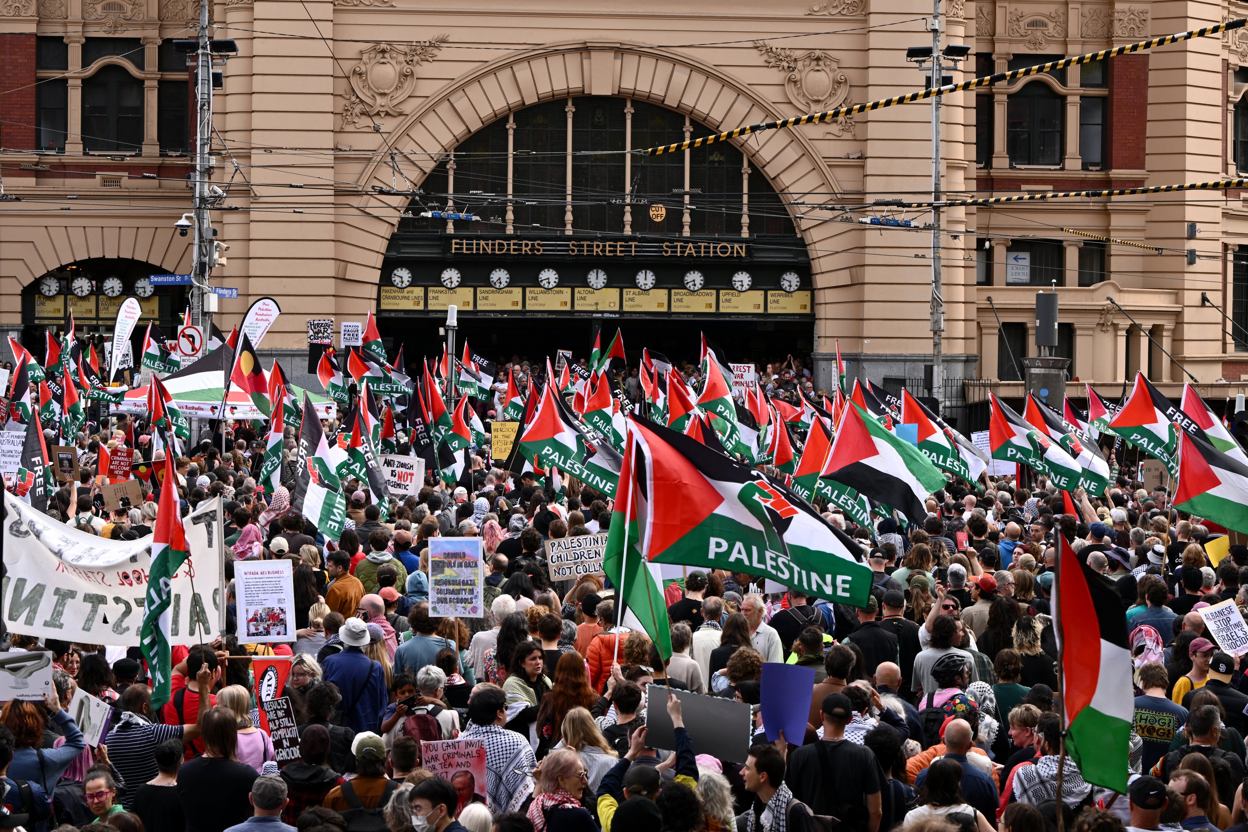 Protesters gather outside Flinders Street Station in Melbourne. Photo: EPA