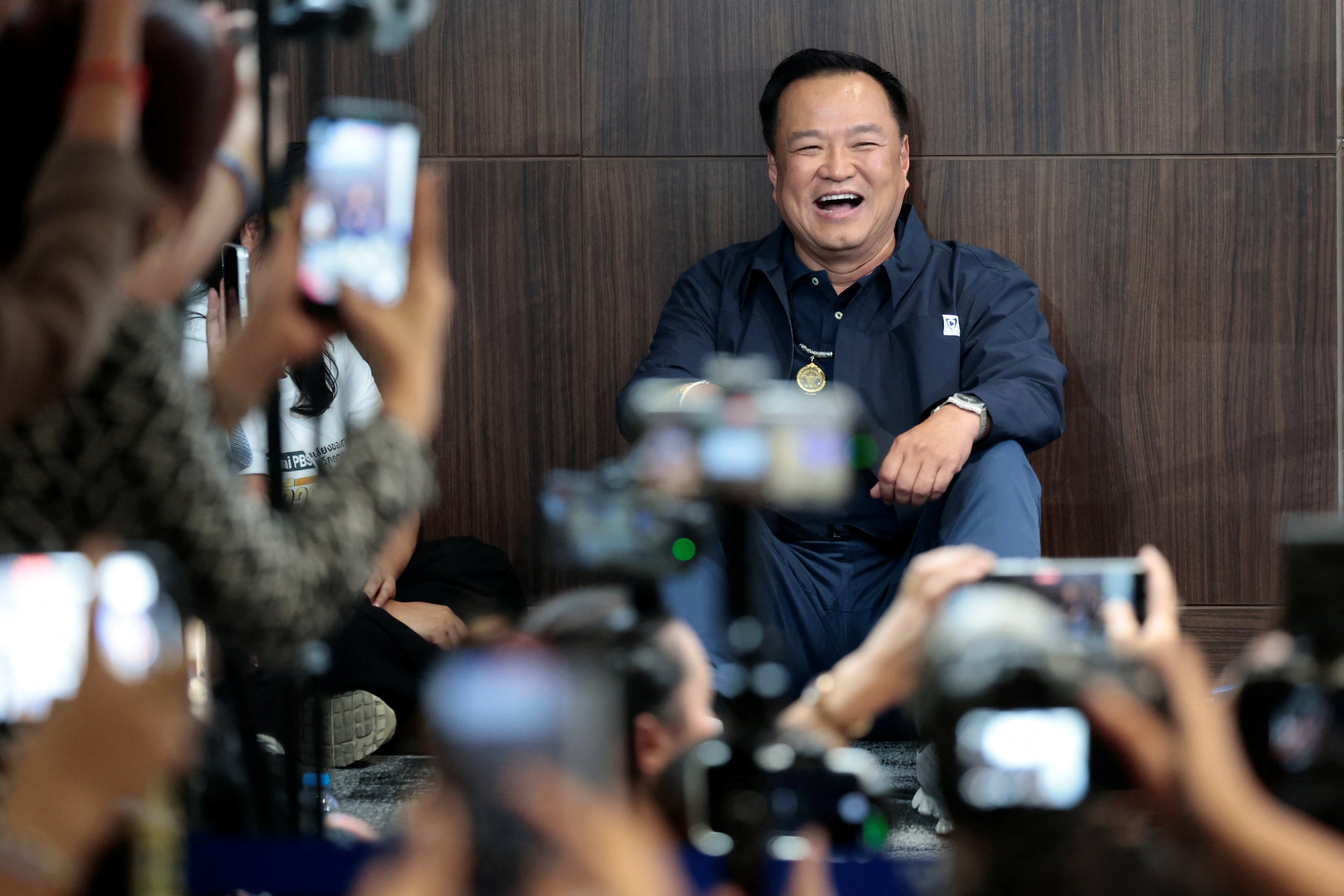 Thailand’s caretaker PM, Anutin Charnvirakul, reacts on Sunday in Bangkok as his party takes the lead. Photo: Reuters