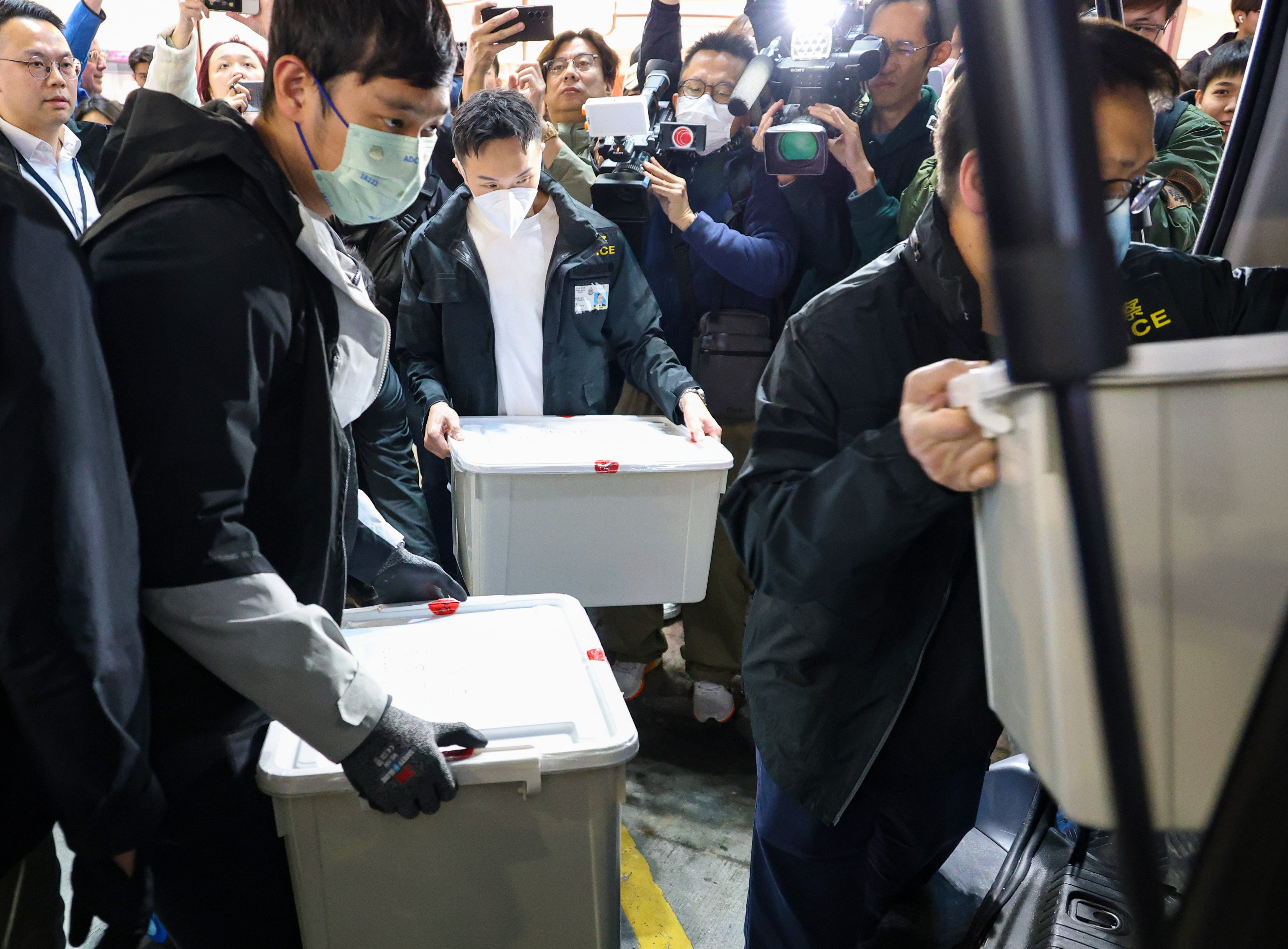 Officers from the commercial crime bureau searched the lawyer’s office in Mong Kok on Monday night, leaving with about 10 boxes of documents. Photo: Handout