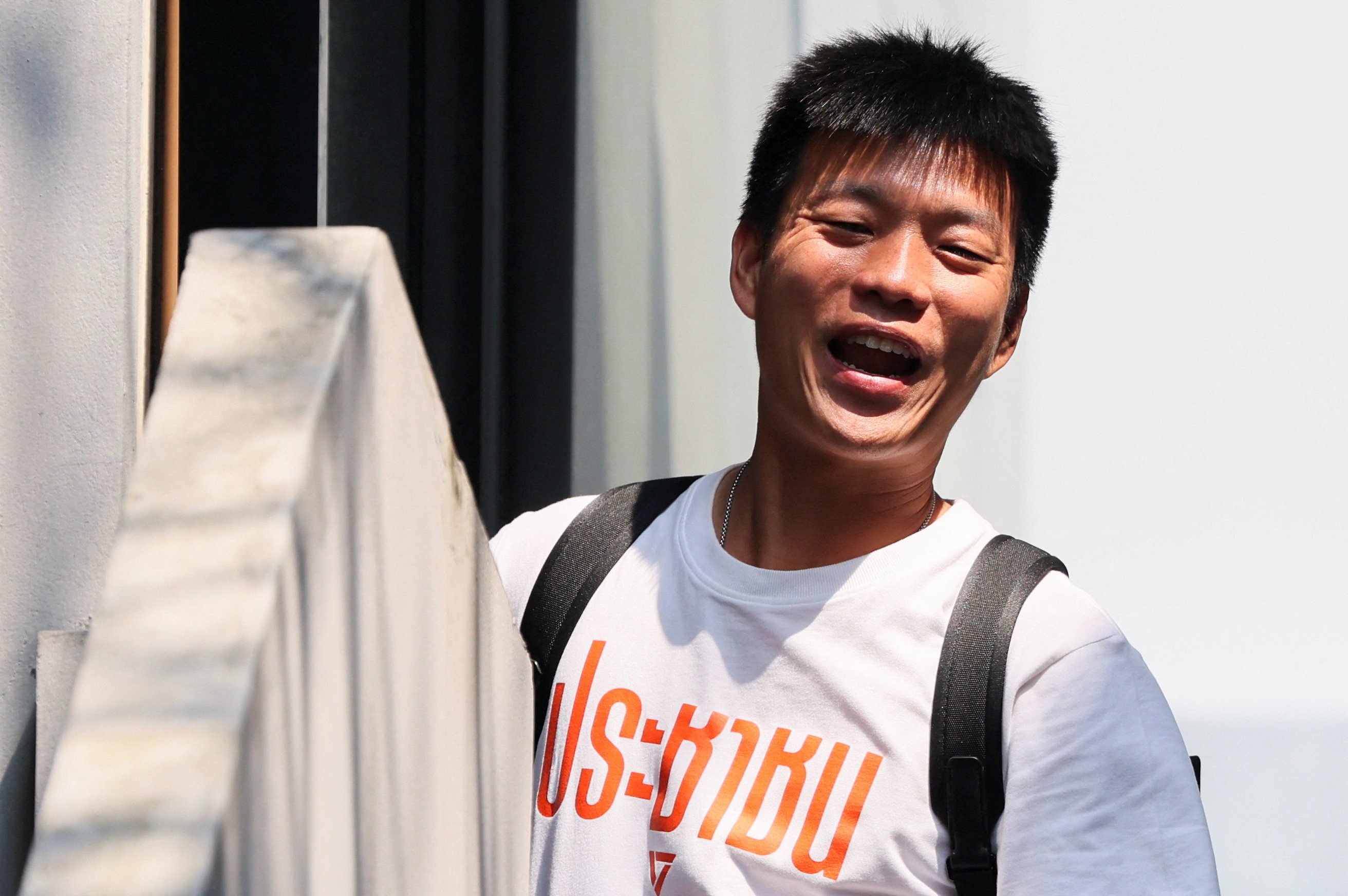 Natthaphong Ruengpanyawut arrives at the headquarters of the People’s Party after the Bhumjaithai Party won the general election on Sunday. Photo: Reuters