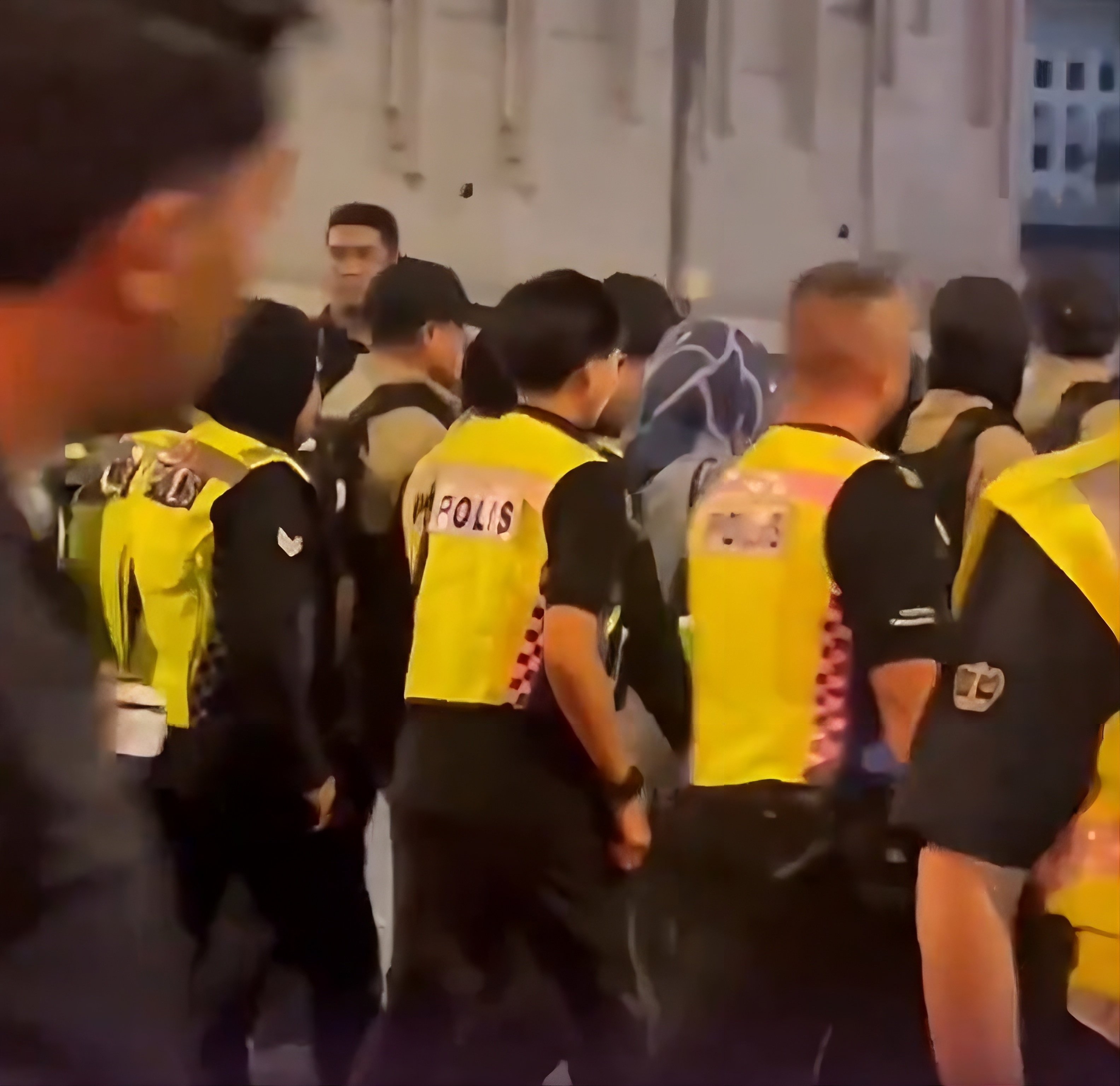 A still from footage circulated on social media shows a person being detained in central Kuala Lumpur on Saturday, after police denied permission for an “Anti-Illegal Houses of Worship” rally. Photo: X/bckupacc99