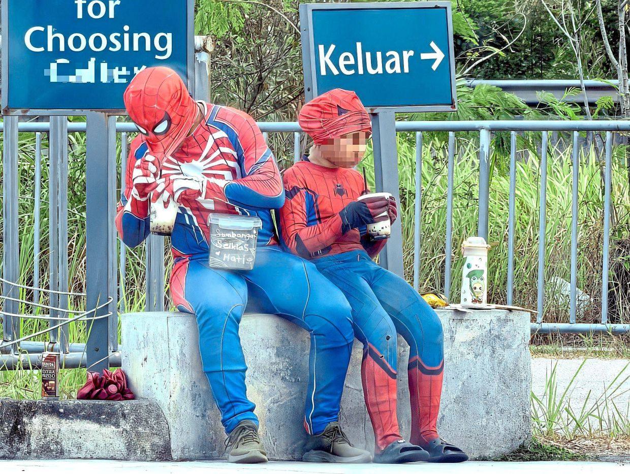 The man who was wearing a Spider-Man costume and the young girl were spotted at a petrol kiosk in Cheng, Malaysia’s Melaka state. Photo: The Star