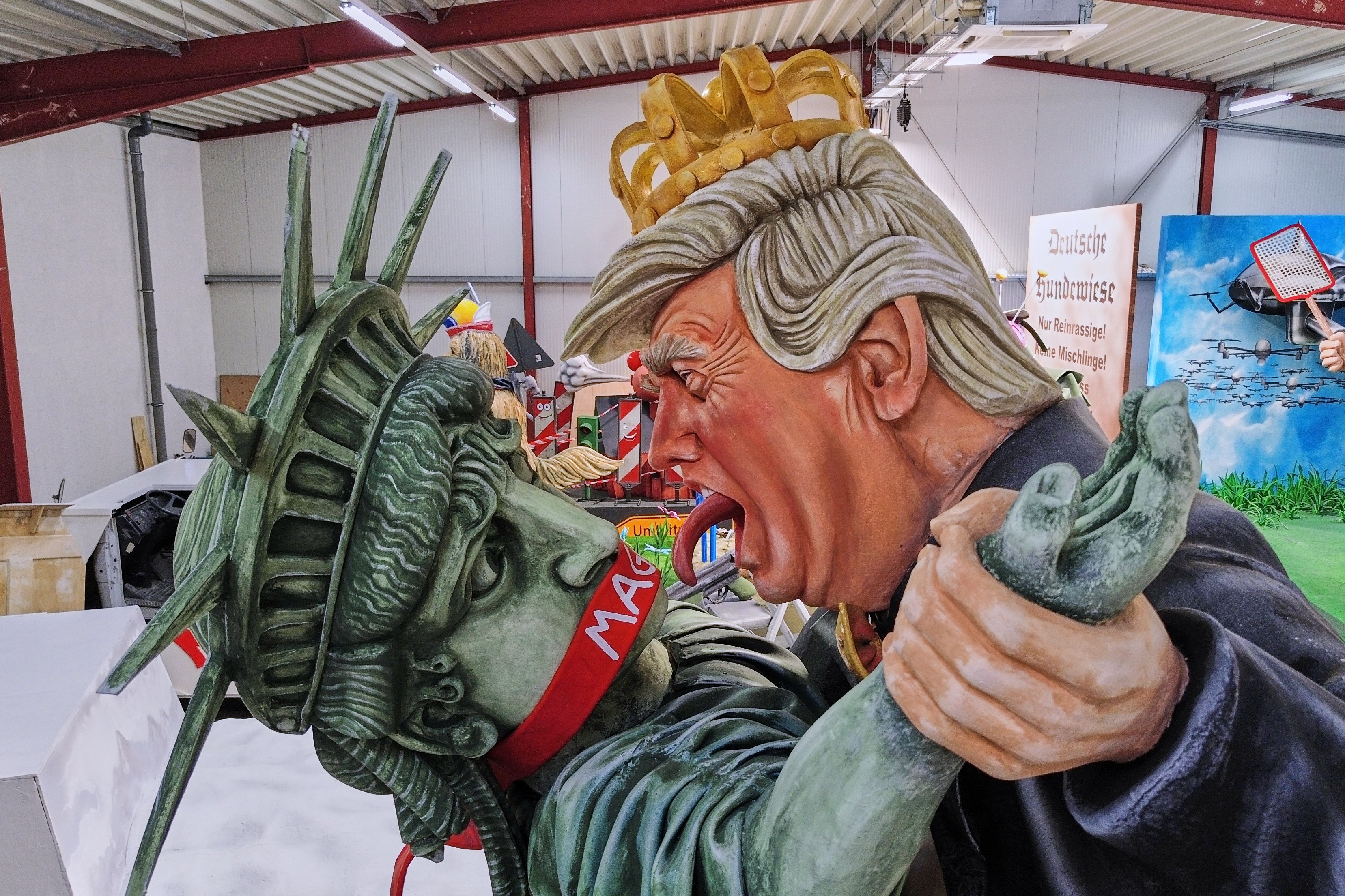 A carnival float featuring a figure of US President Donald Trump dancing with the Statue of Liberty is unveiled for the Mainz carnival in Germany on Tuesday. Photo: AP