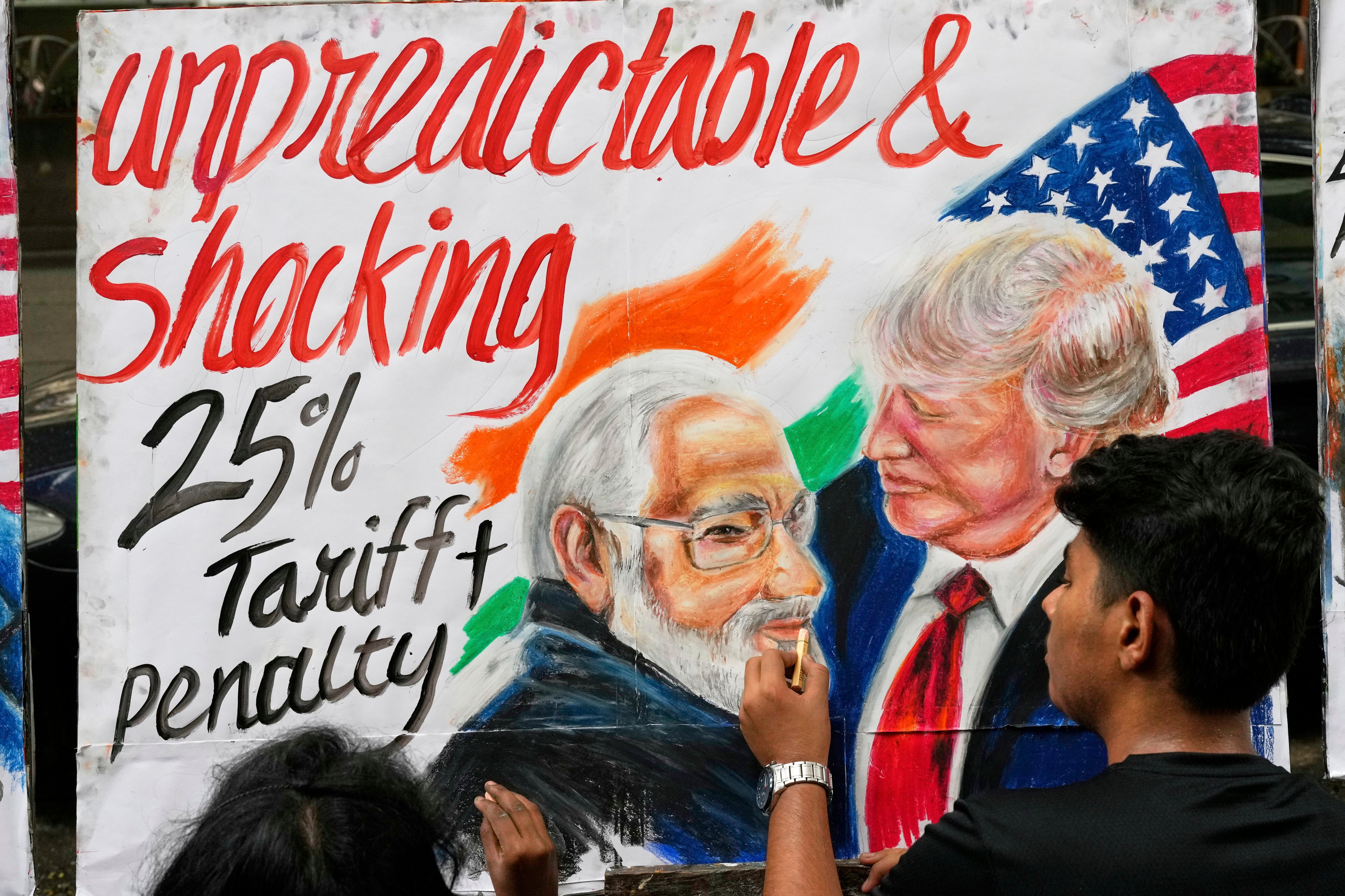 An art student completes a mural of US President Donald Trump and Prime Minister of India Narendra Modi, in Mumbai, India in August 2025. Photo: AP