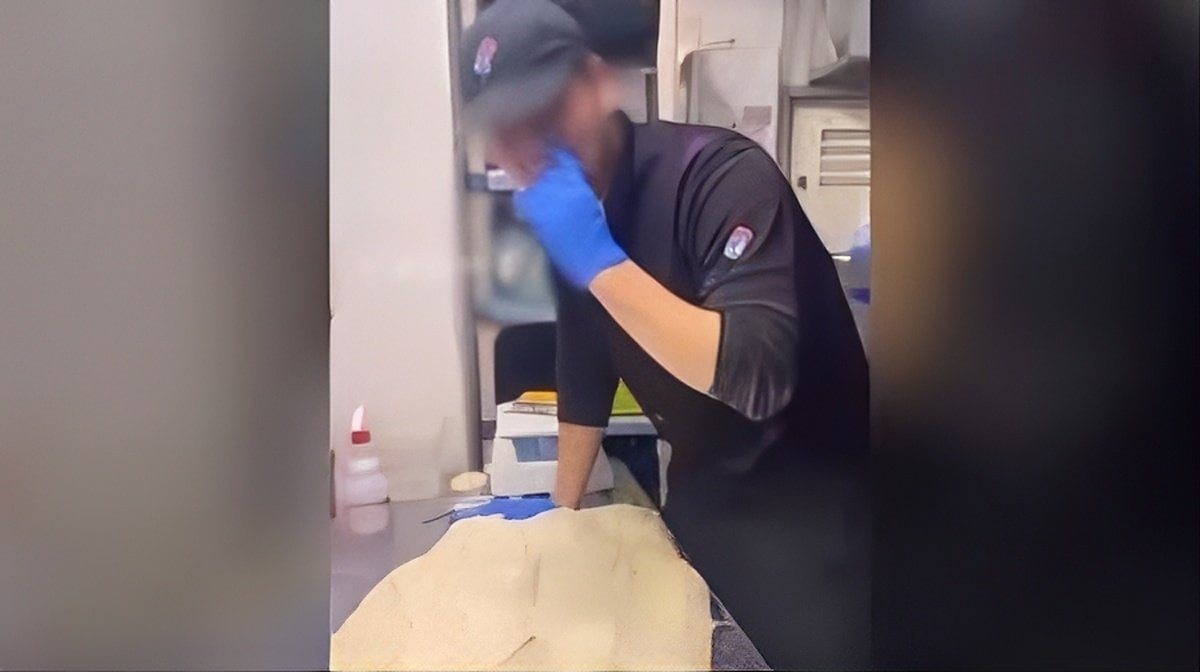 A chef picks his nose and then wipes his finger on some dough in a “baito tero” video. Photo: Handout