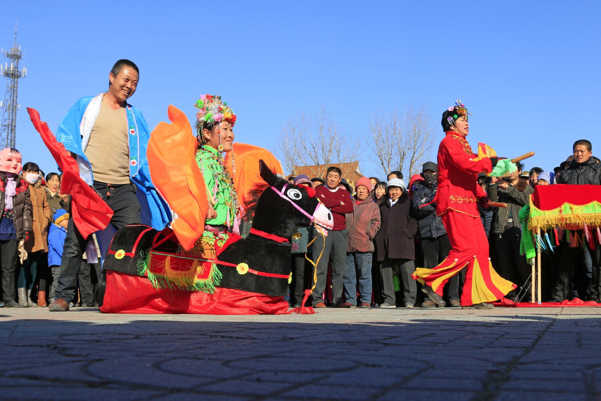 People perform a colourful traditional style yangko folk dance in China. Photo: Shutterstock
