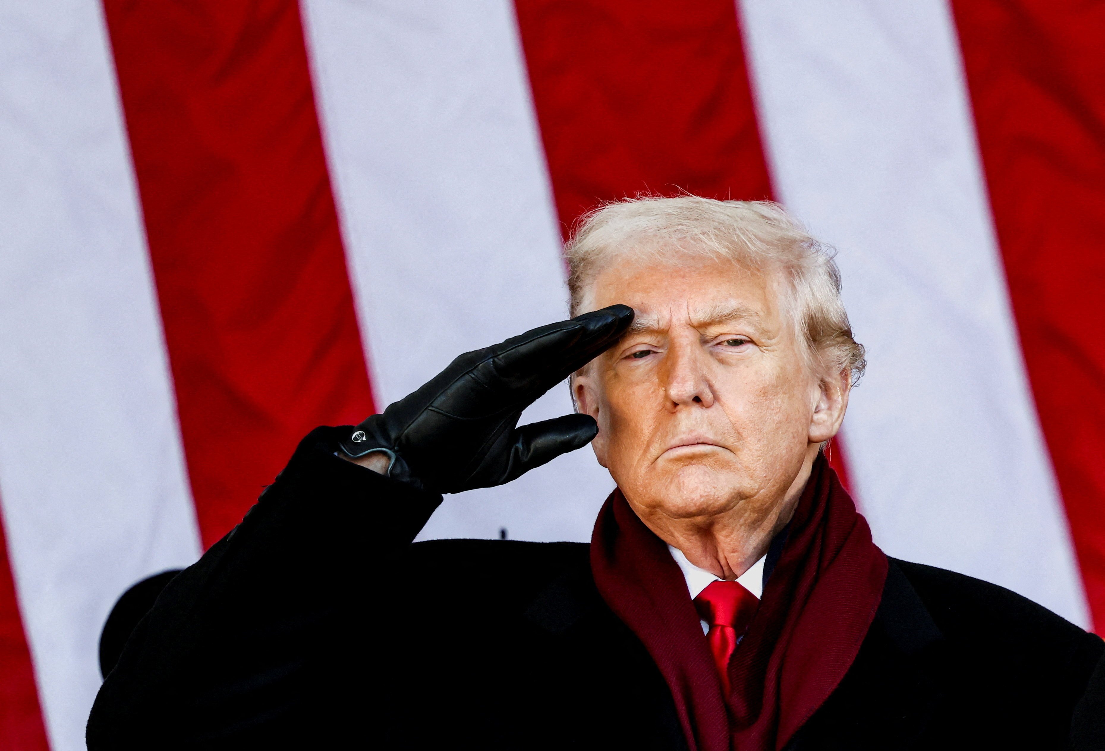 US President Donald Trump salutes during a Veterans Day ceremony in November. Photo: Reuters