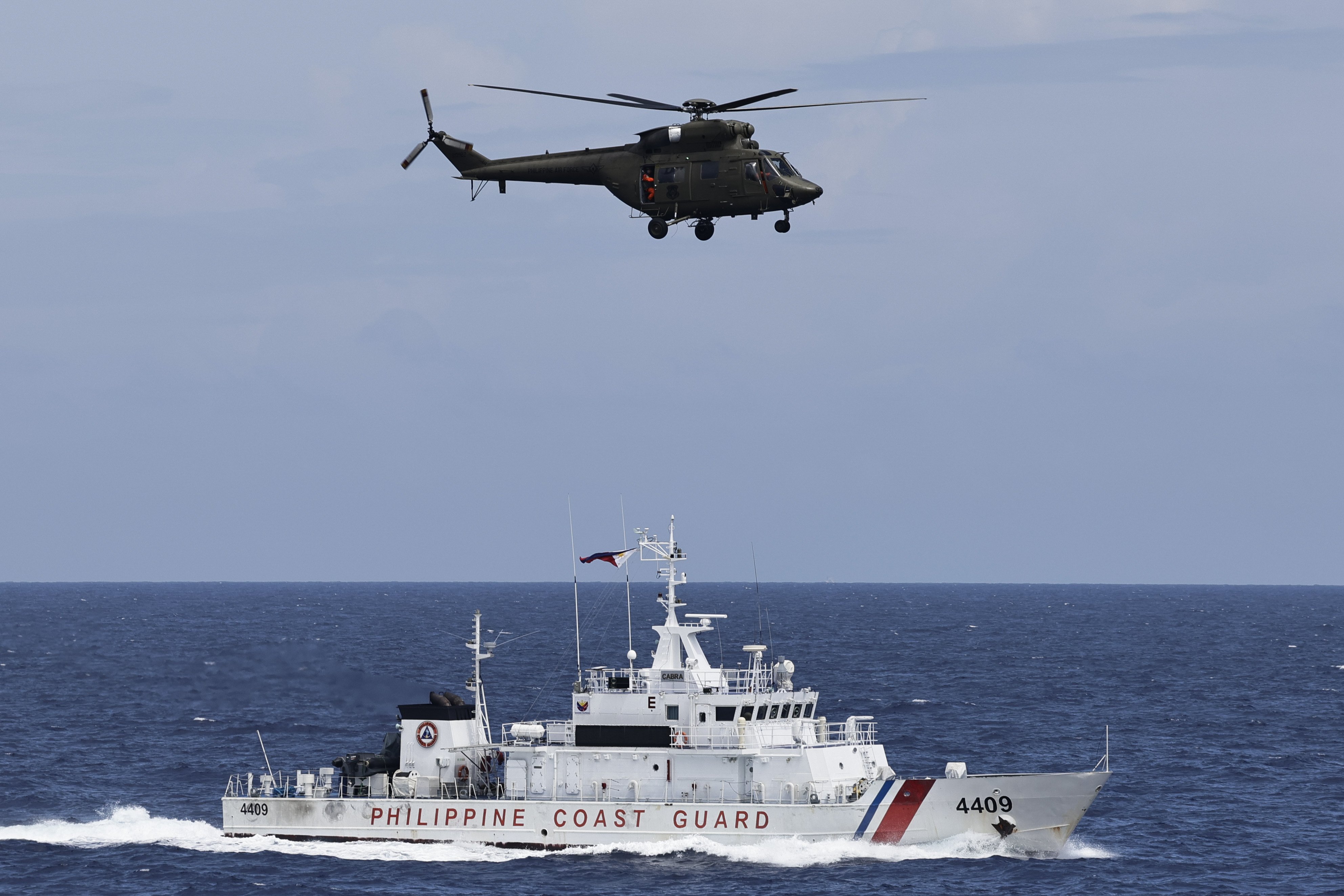 A Philippine coastguard vessel sails in disputed waters of the South China Sea during a maritime drill. Photo: EPA-EFE